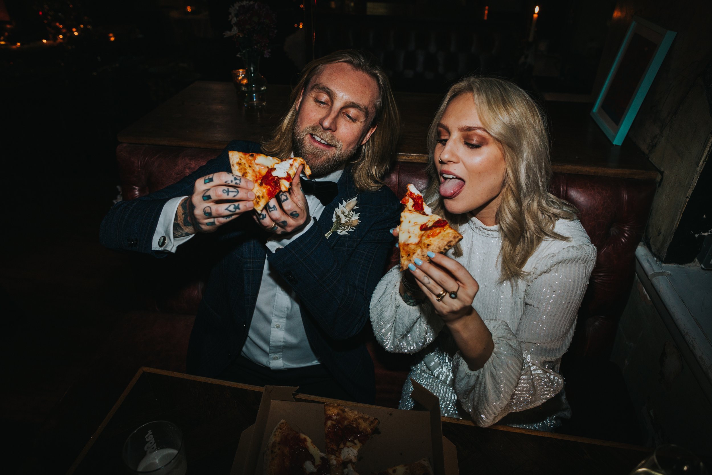 Bride and Groom attack pizza. 