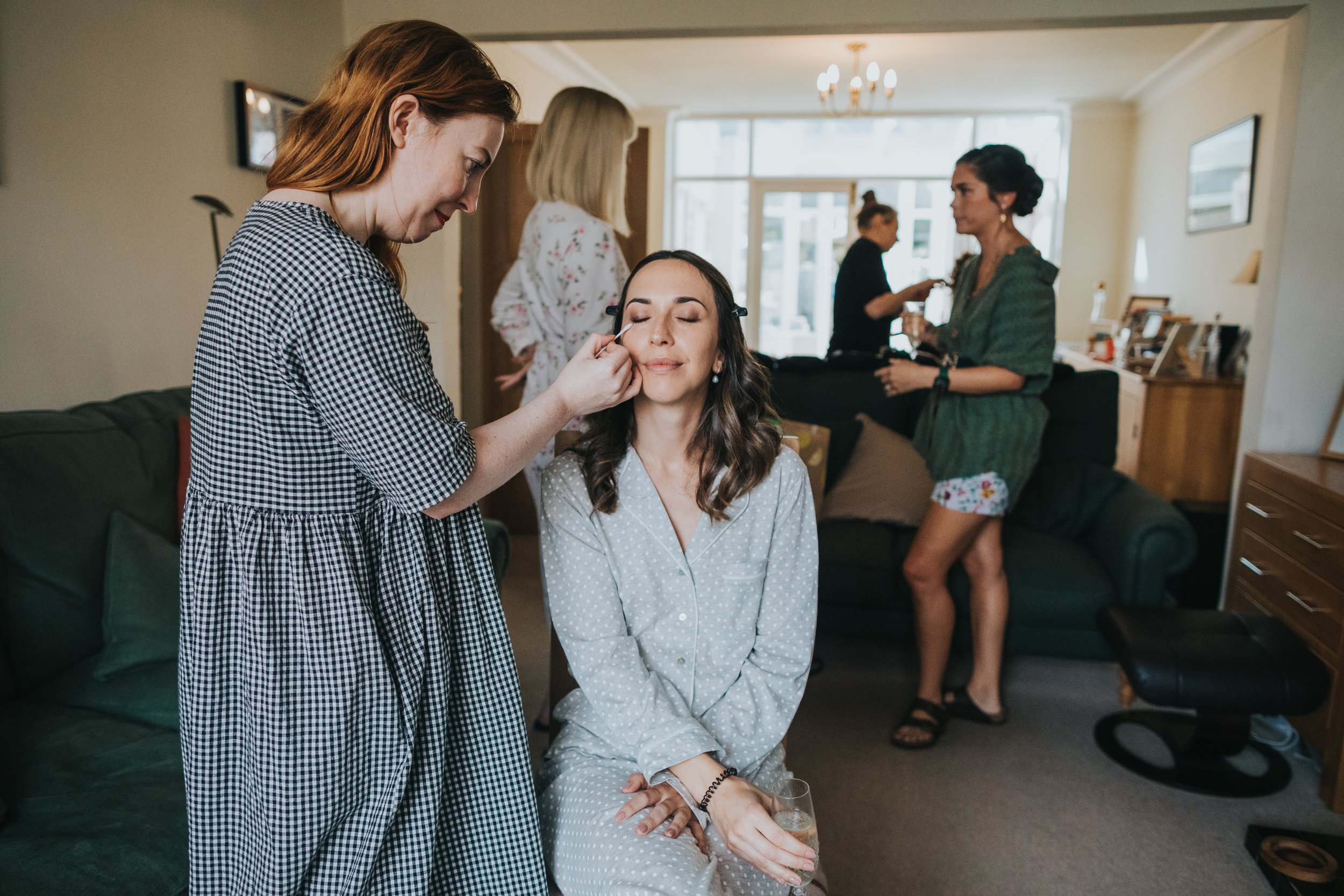 Bride getting her make up done.