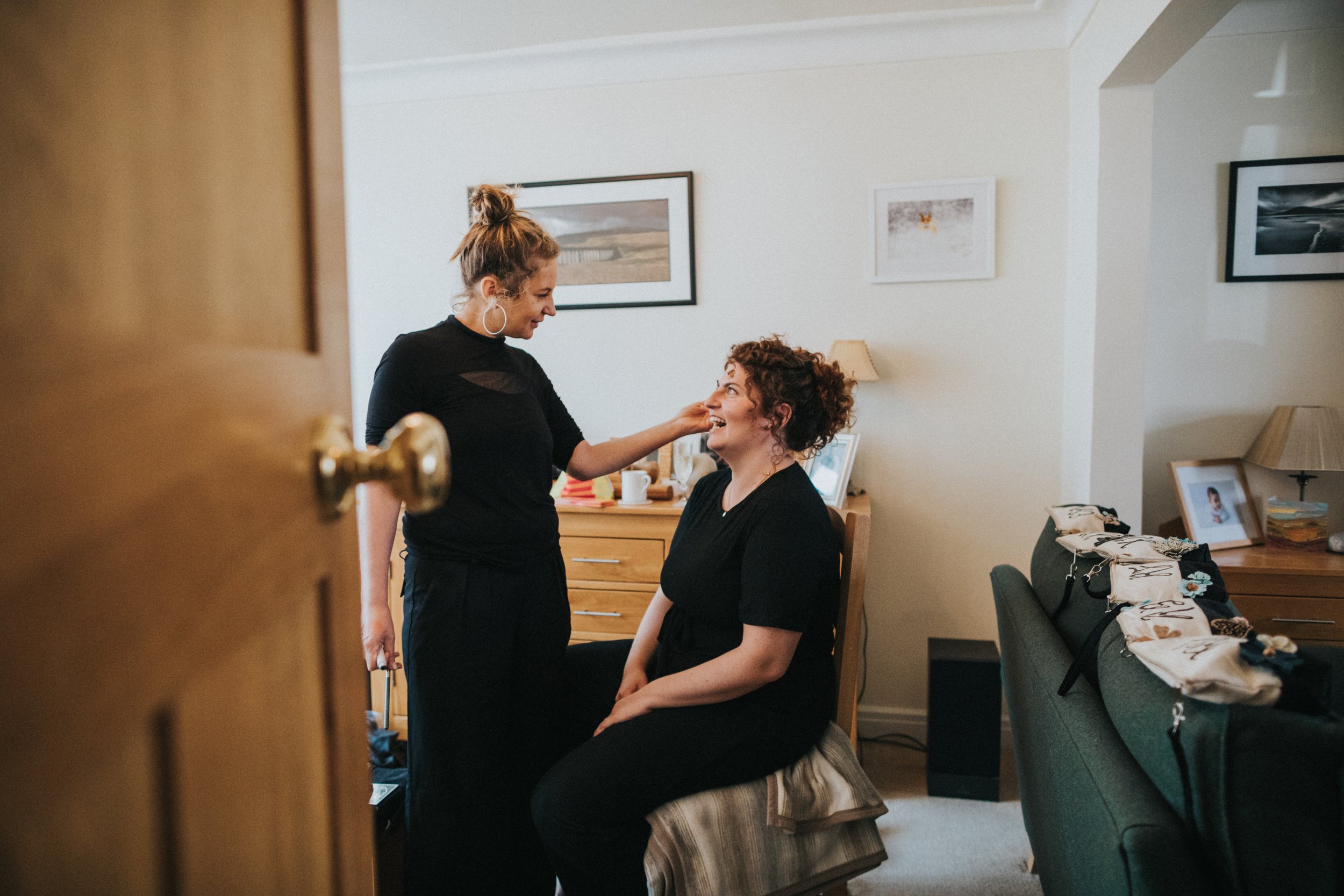 Bridesmaid having make up done. 