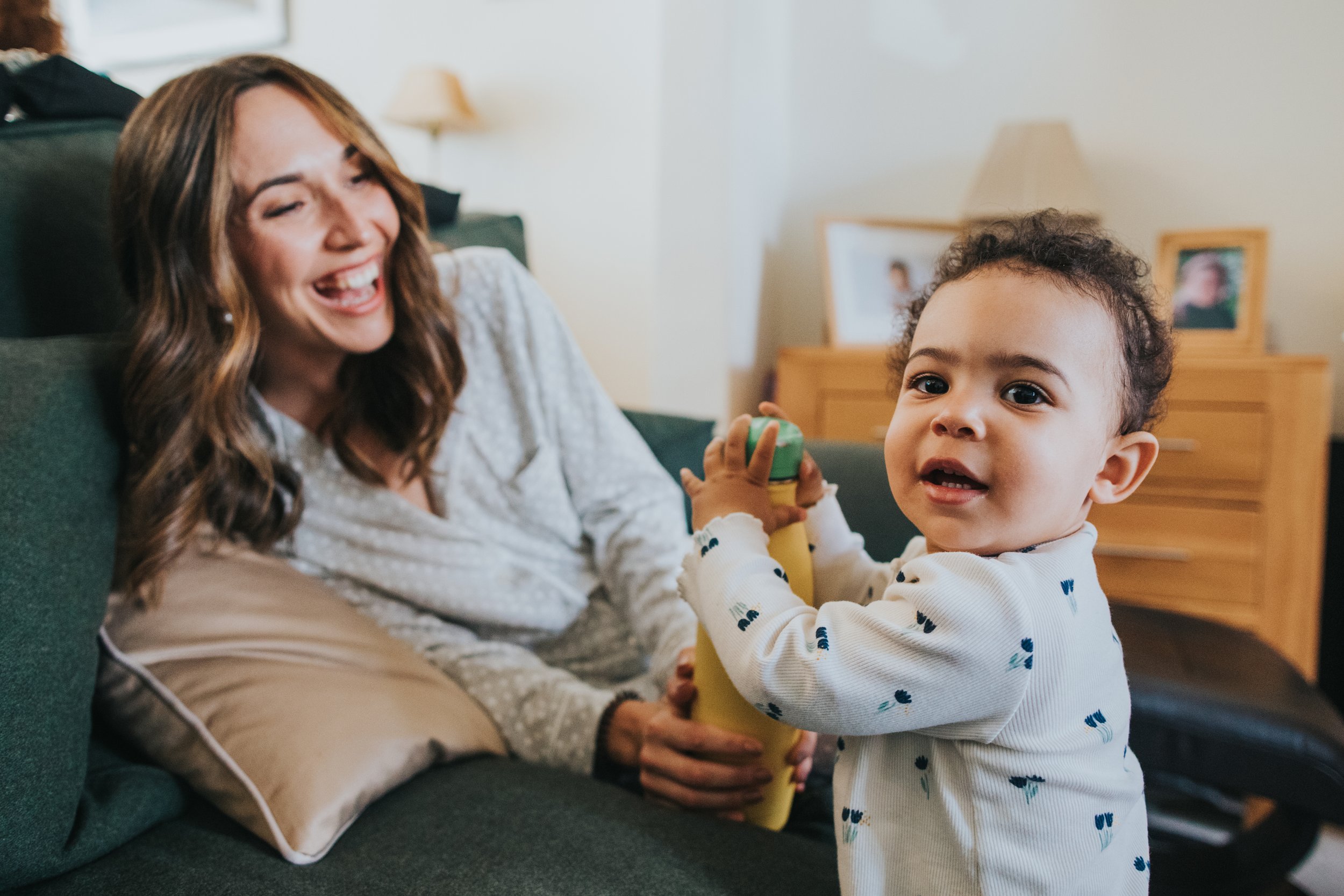 Bride playing with her daughter on the morning of her wedding day.