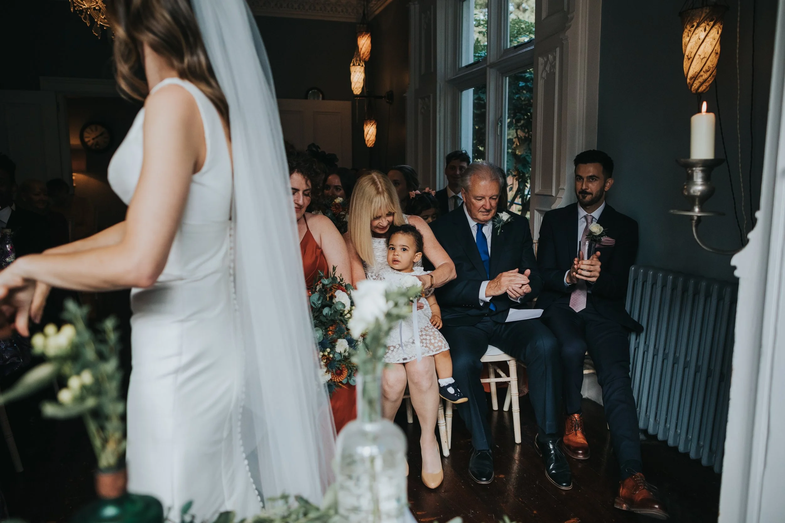Bride and Grooms daughter watching her parents getting married. 