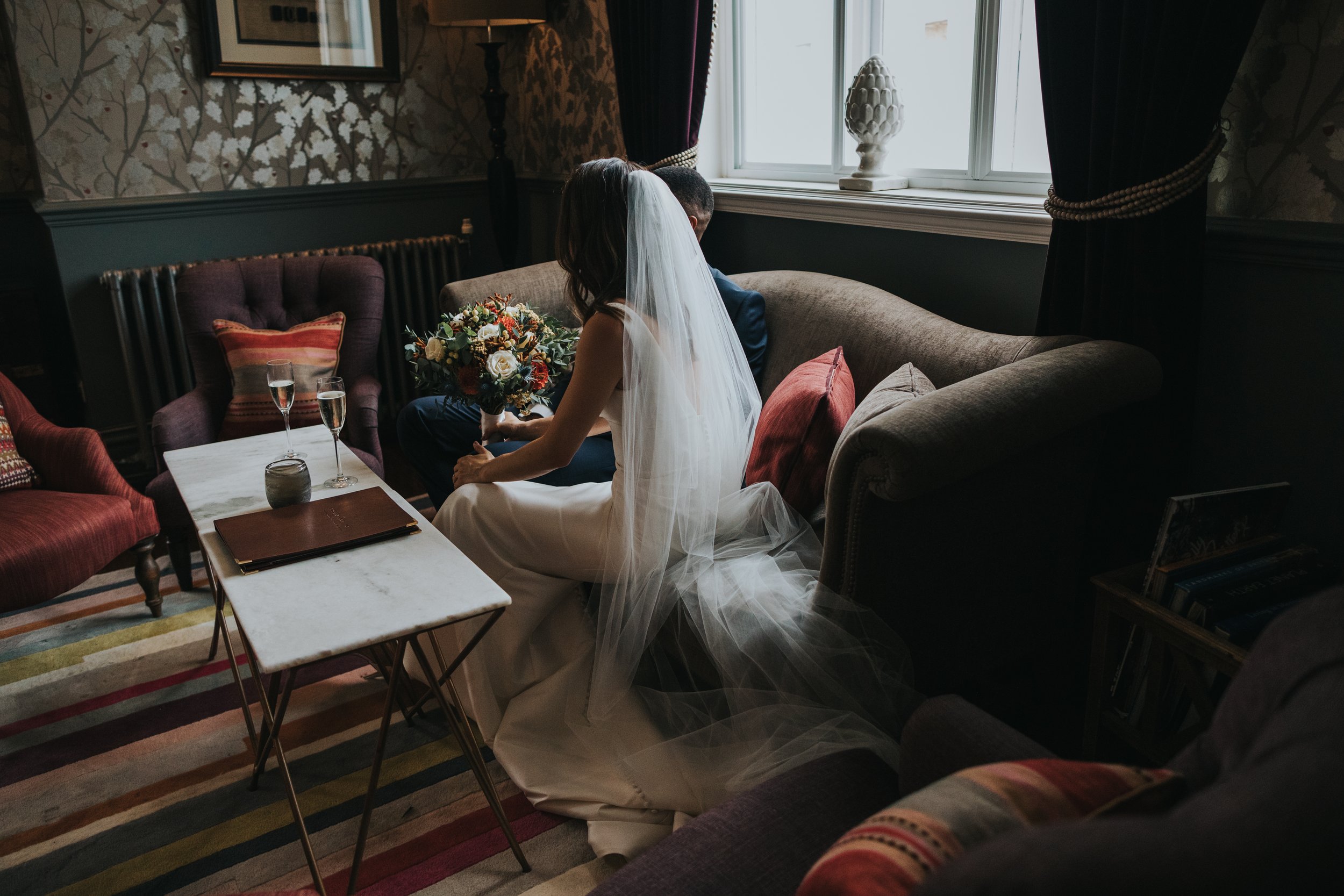 Brides veil in the window light.