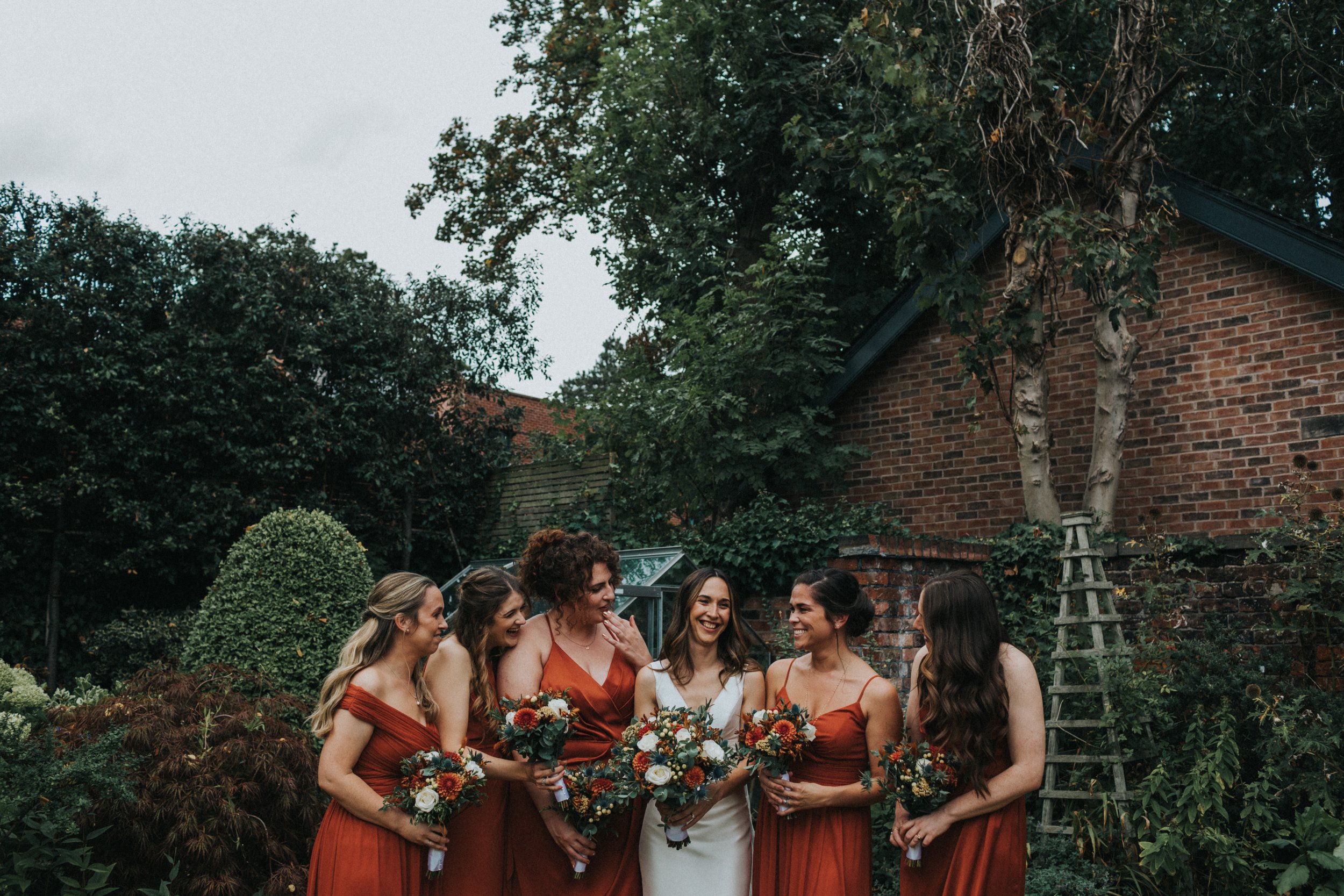 Bridesmaids laughing together. 