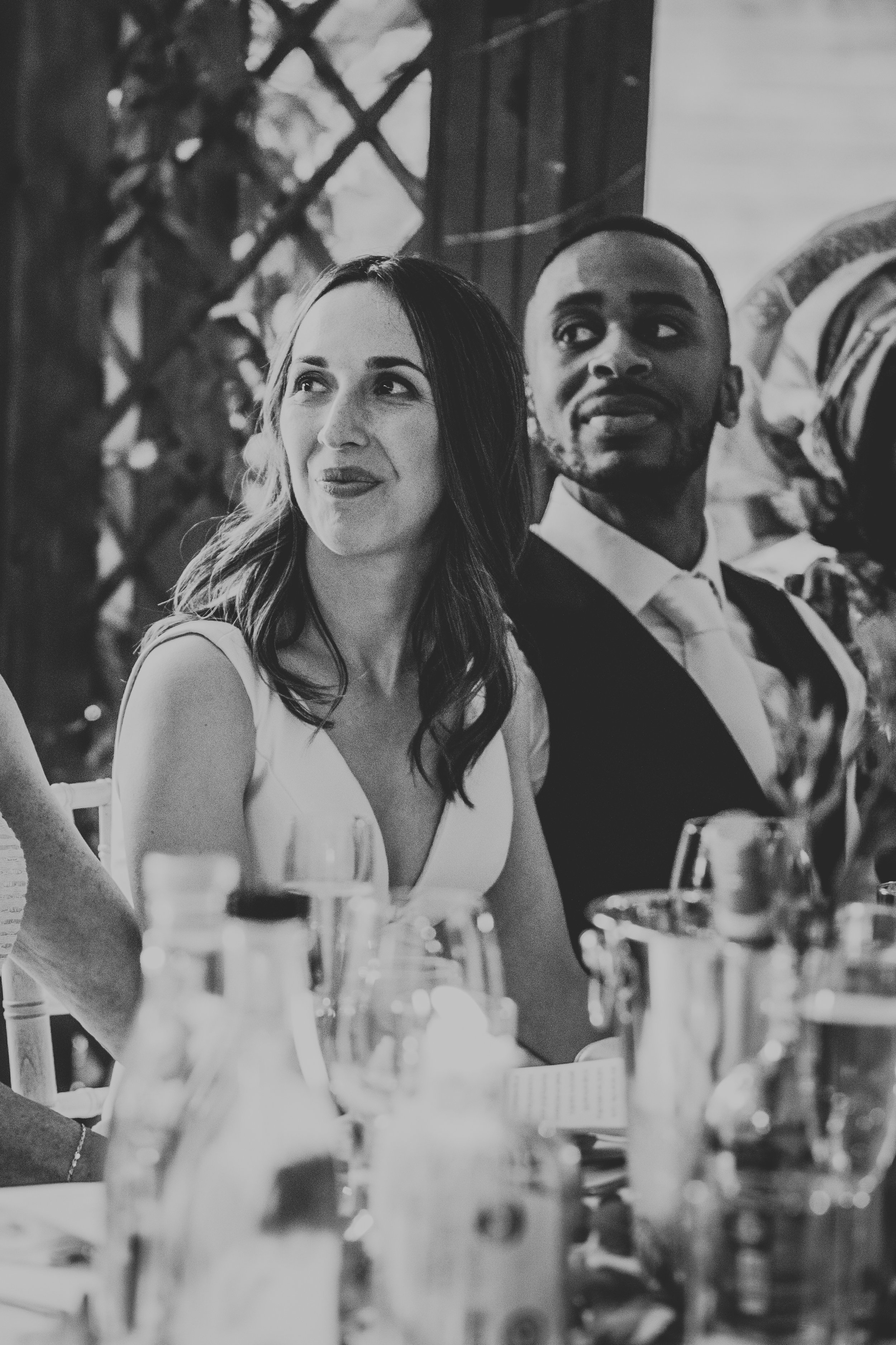 Brides and groom listening to the speeches. 