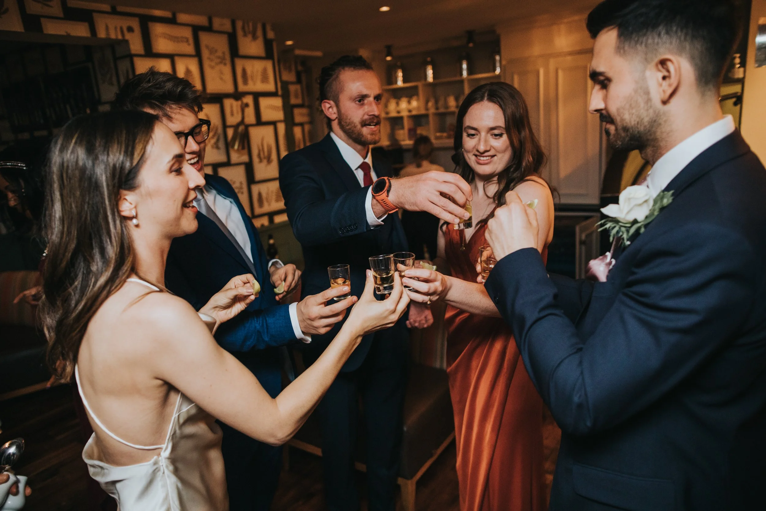 Bride and her friends do shots. 
