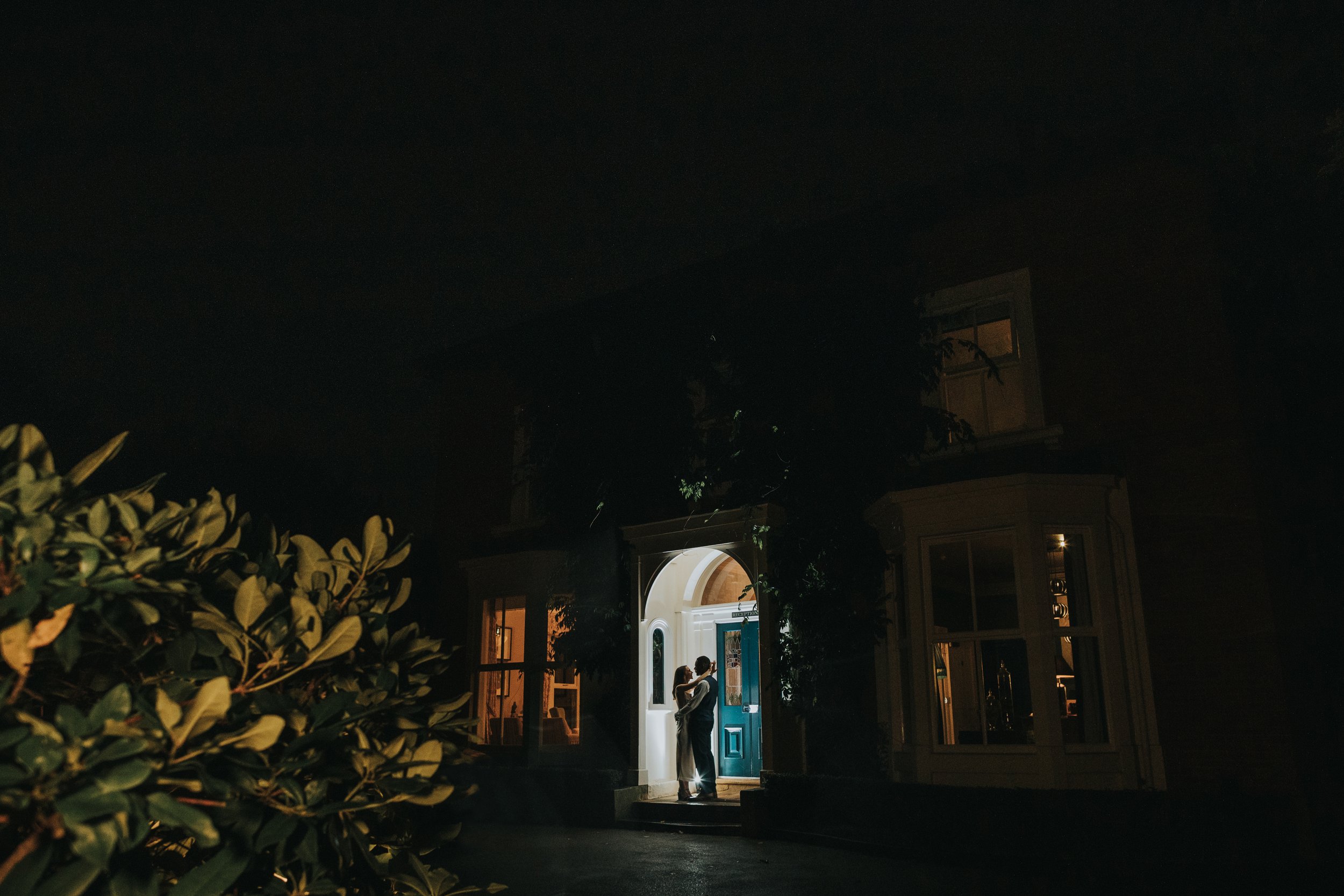 Bride and Groom together in door way at Eleven Didsbury Park on their wedding night. 