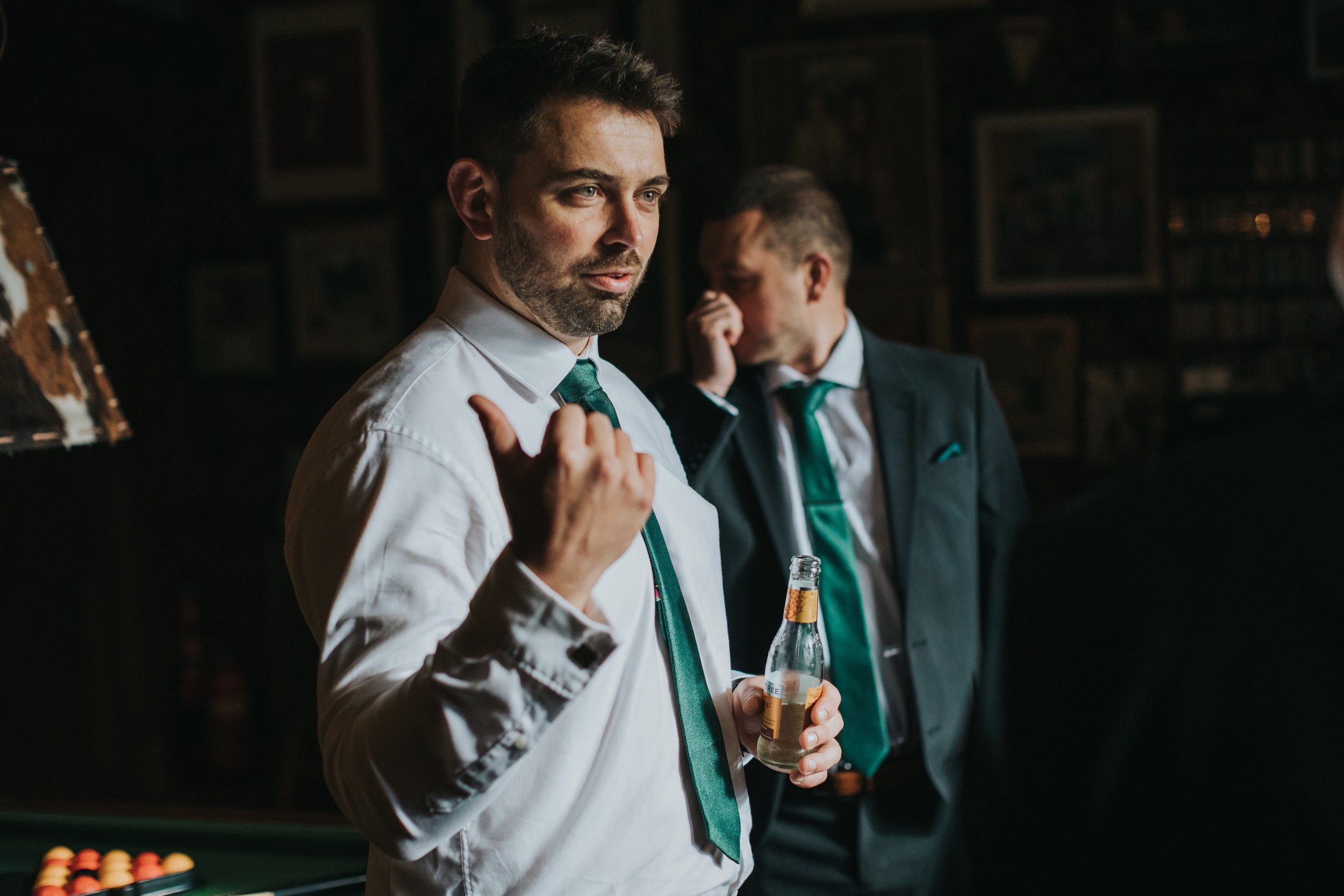 Groomsmen gives directions. 