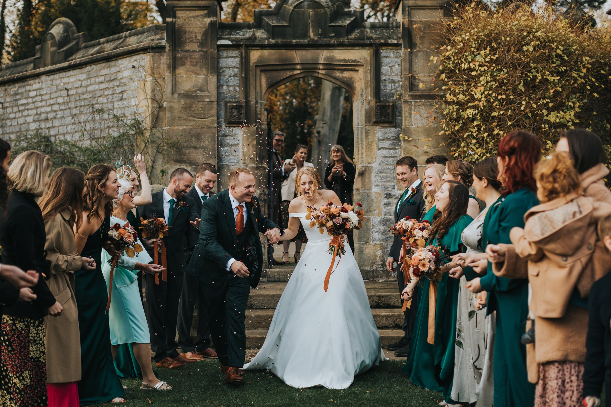 Groom catches his step laughing. 