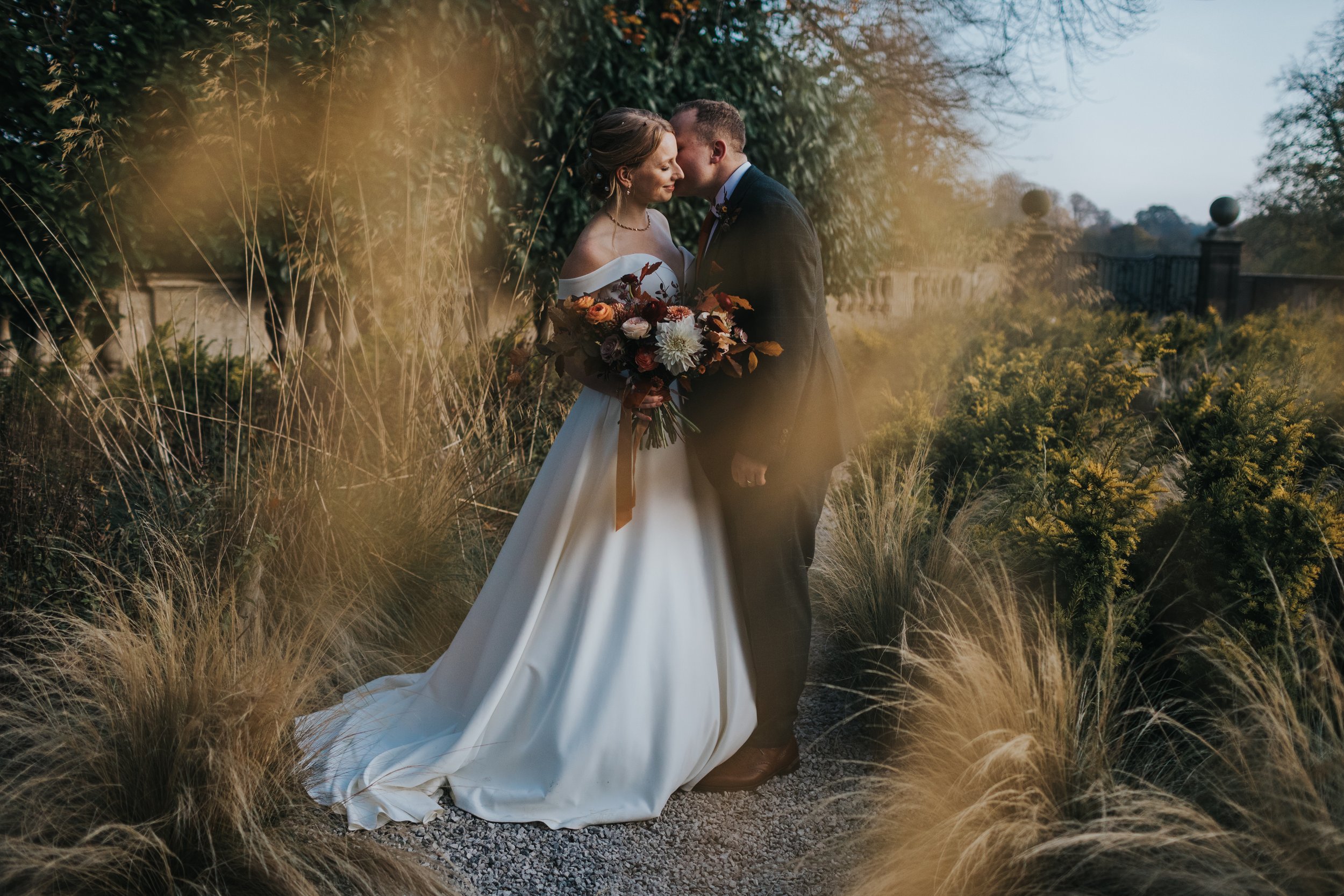 Bride and Groom have a quiet moment together in the walled gardens of Thornbridge Hall, Derbyshire. 