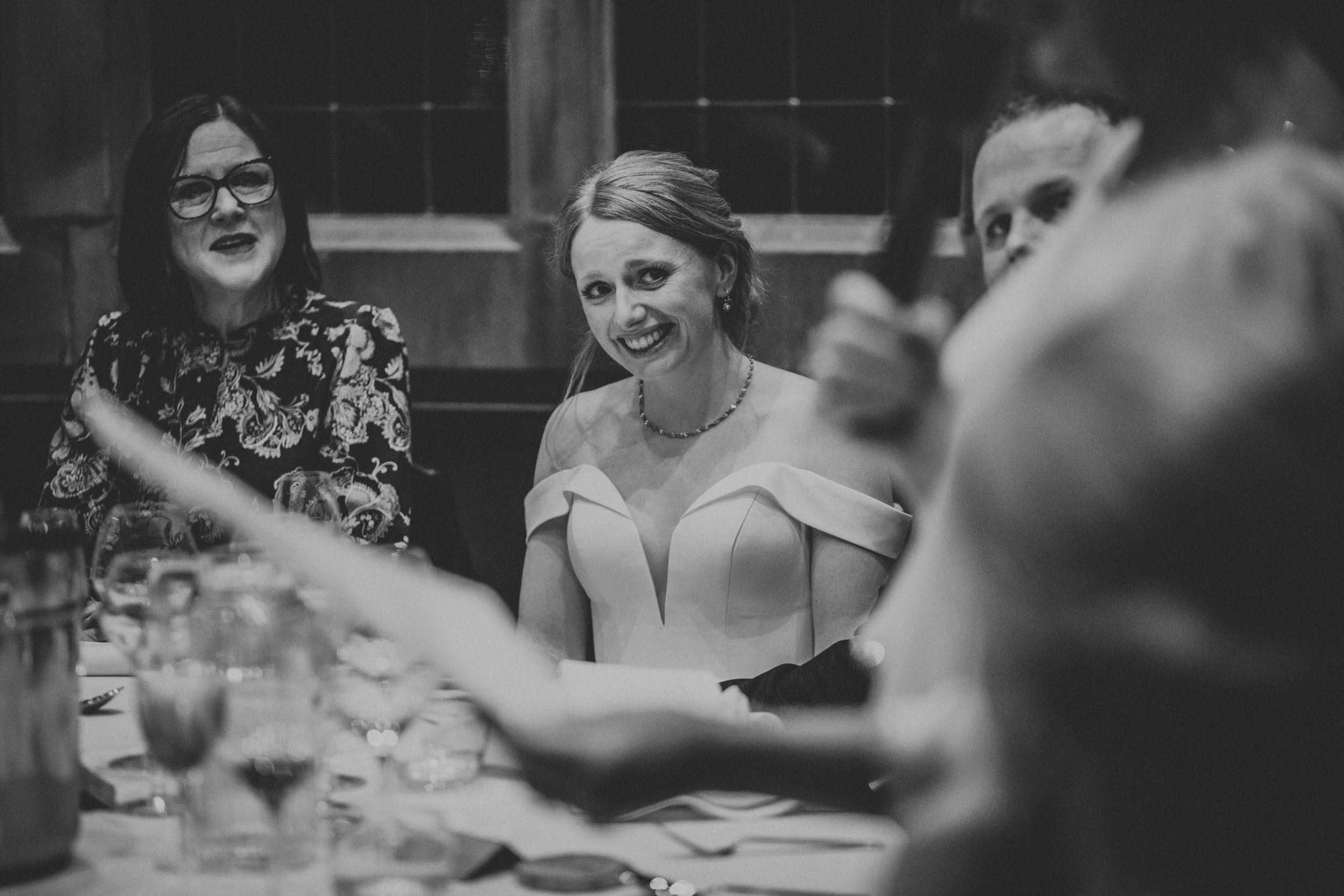 Bride looking at mother while she makes her speech. 