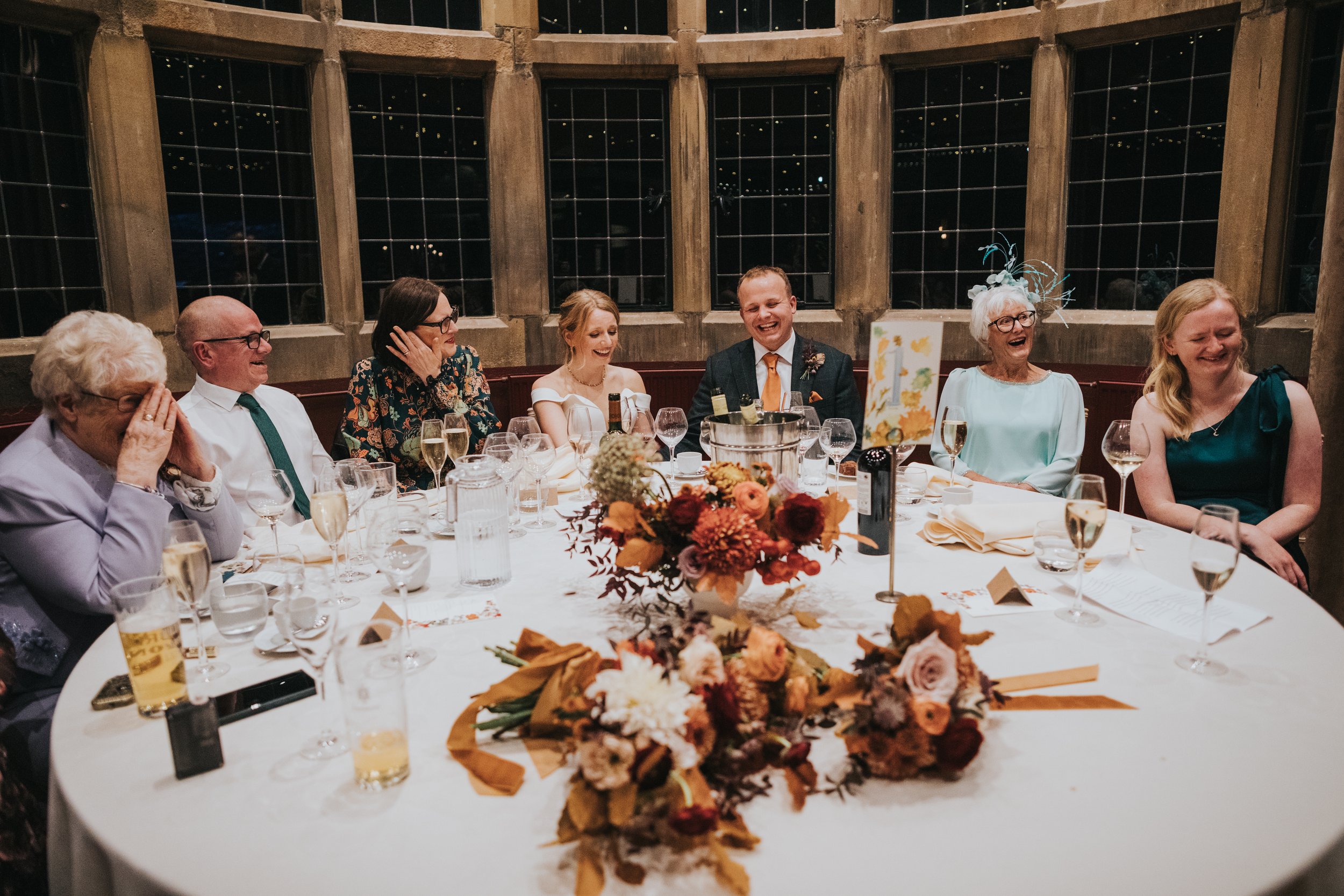 Head table laughing together. 