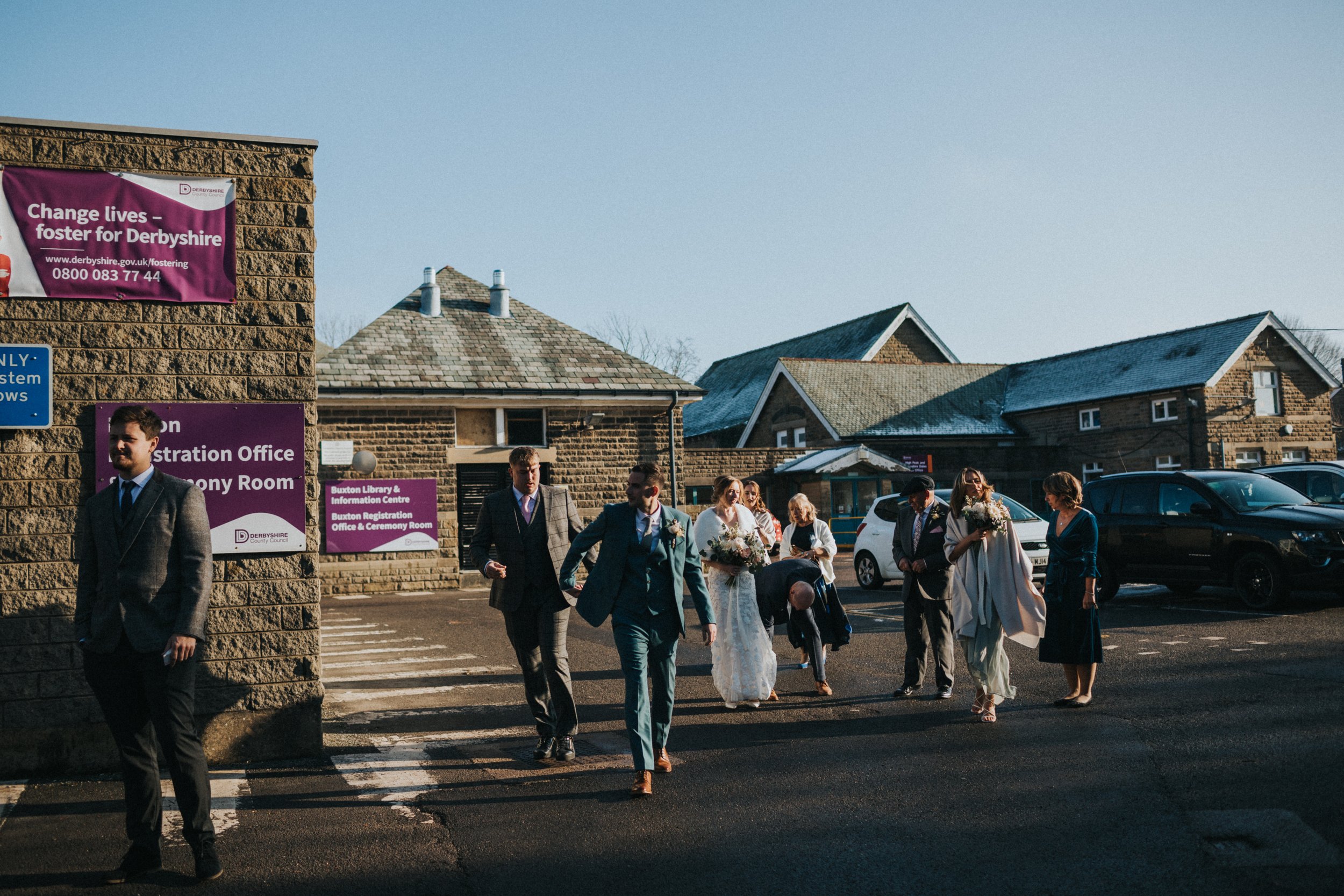 Bride and Groom leave Buxton registry office with thier friends and family. 