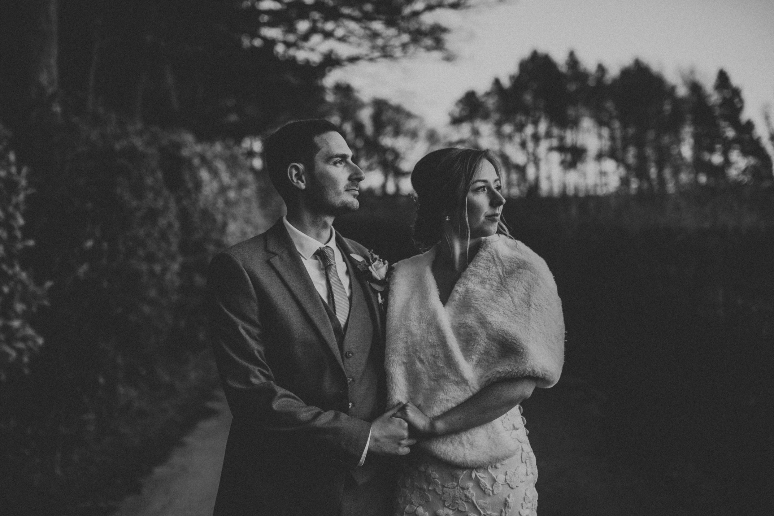 Black and White photo of couple in Glossop country lane. 