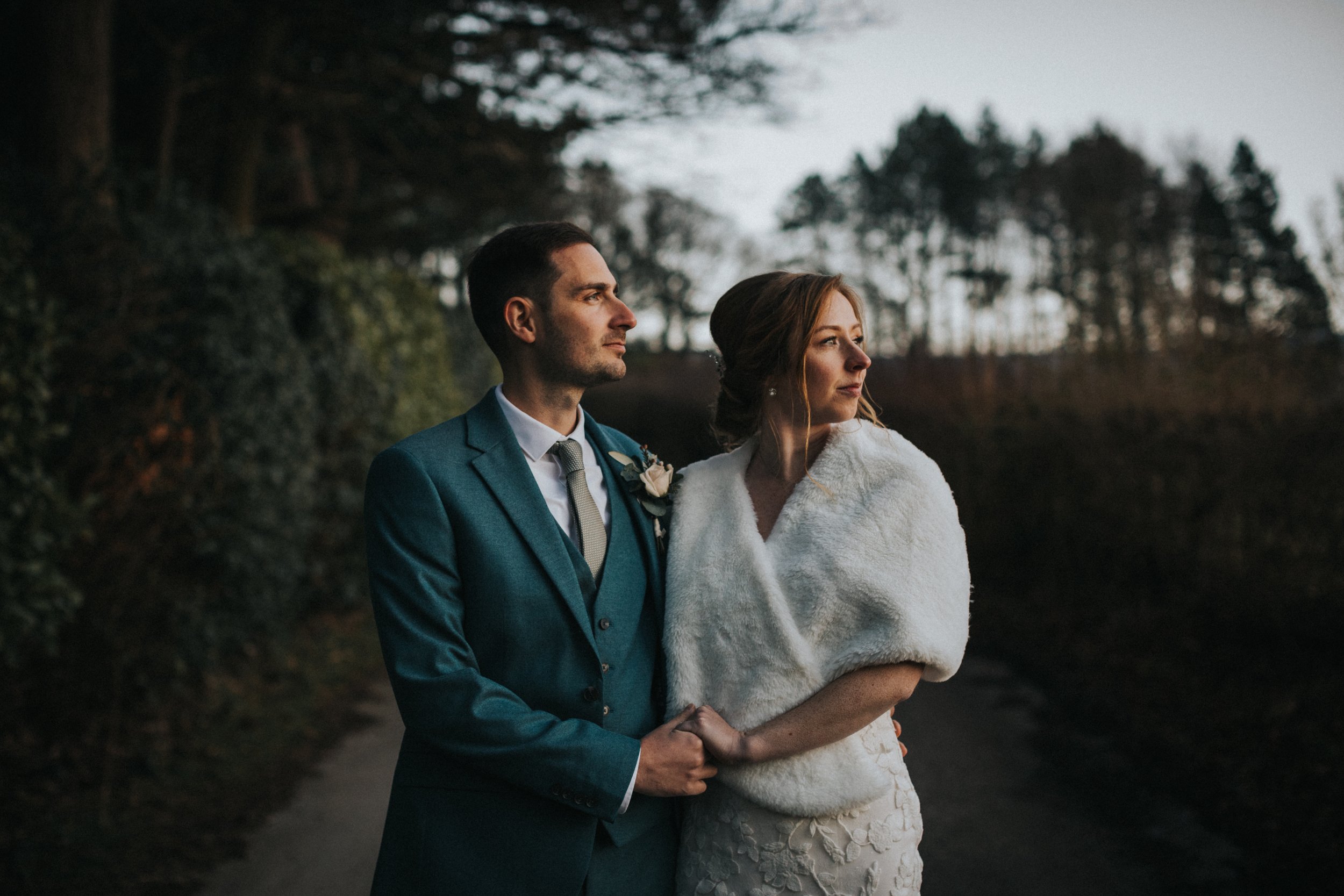 Colour photo of couple in a tree lined country lane in Glossop. 