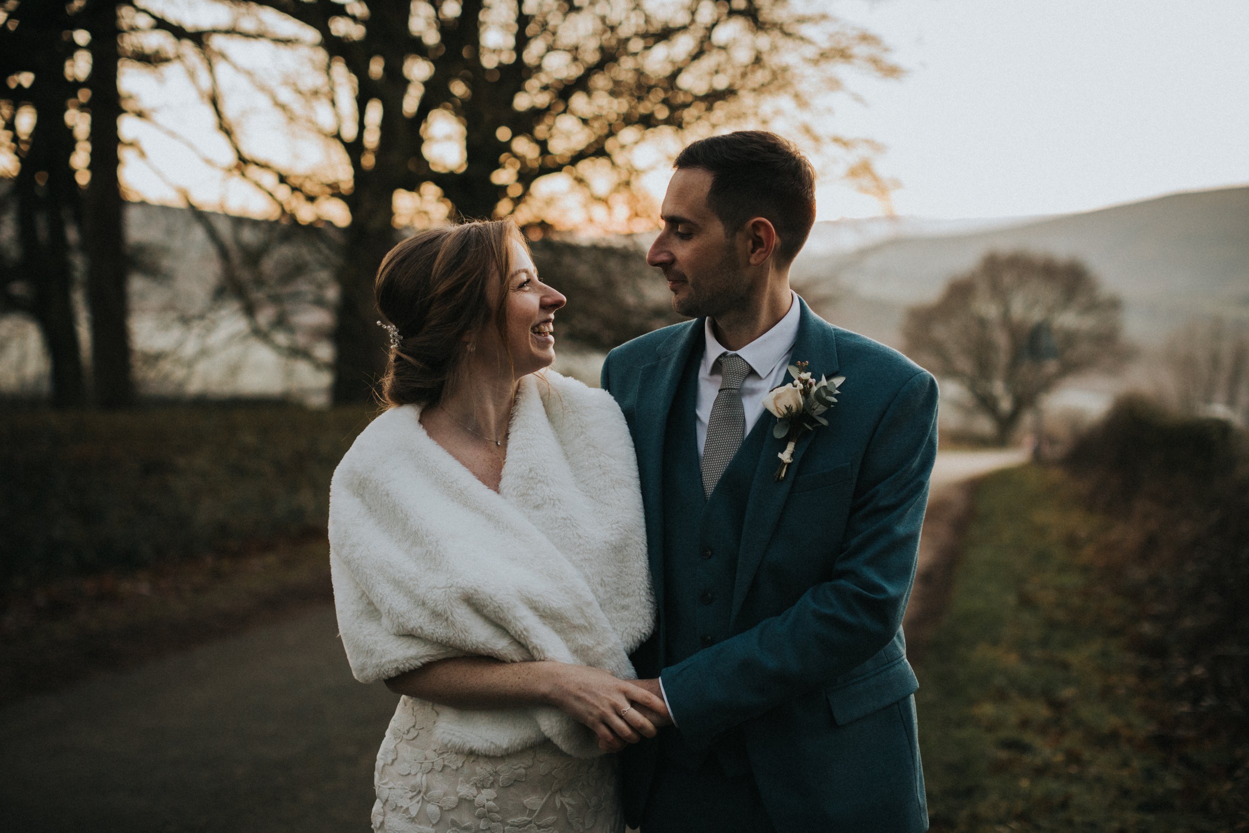 Bride and Groom together on the Derbyshire Level at Sunset on their wedding day. 