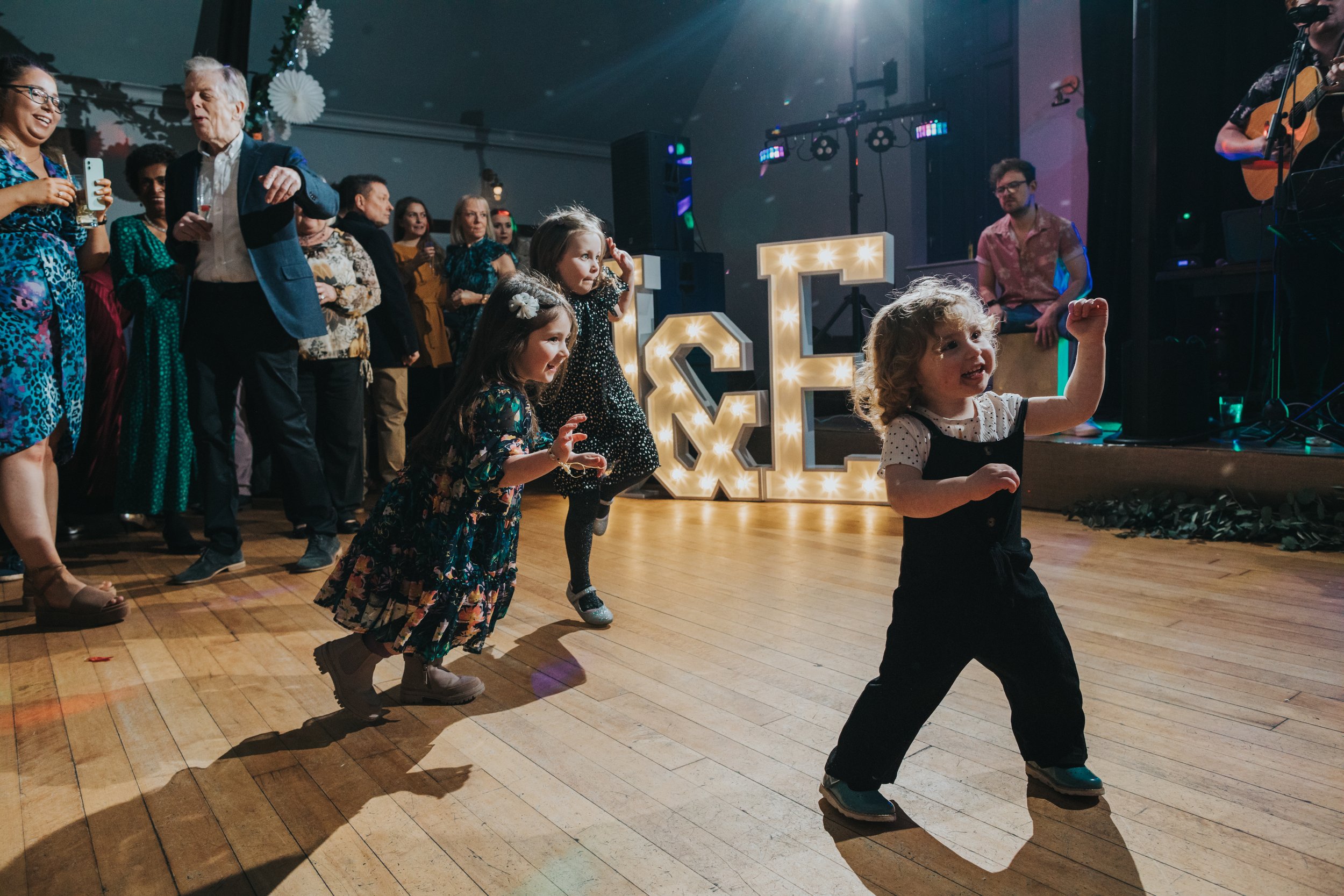 Children running on dance floor of the Crystal Ballroom Glossop. 