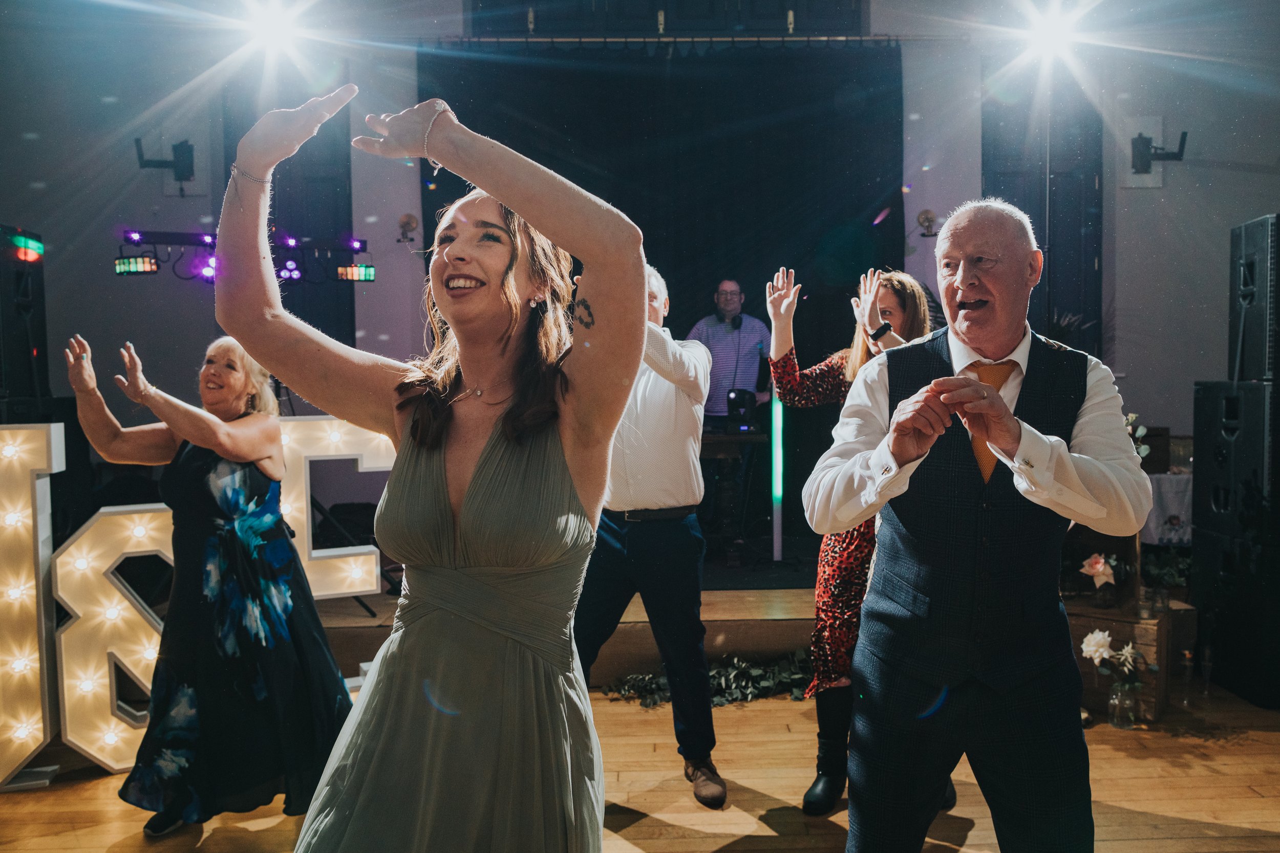 Brides sister and Dad dancing in the flash mob. 