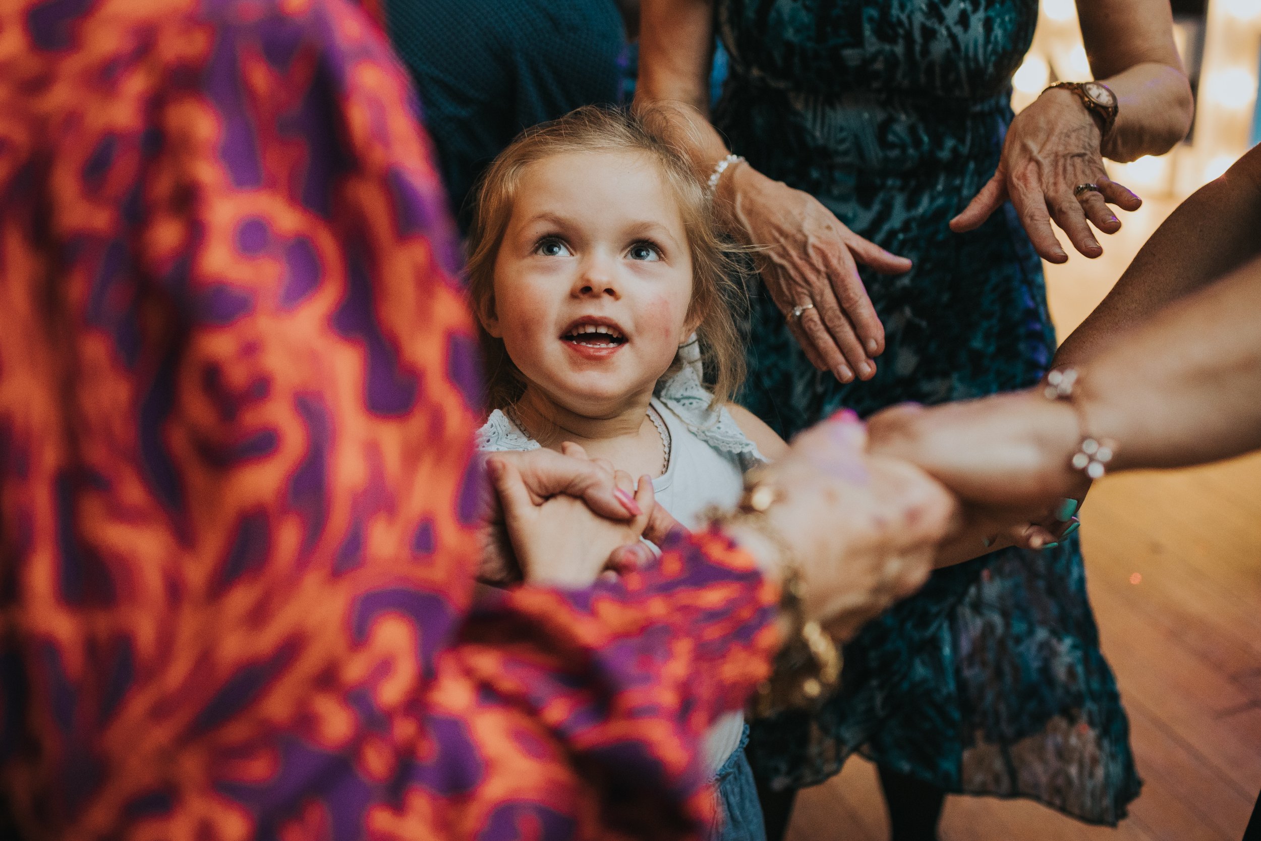 Little girl looking up at her mum. 