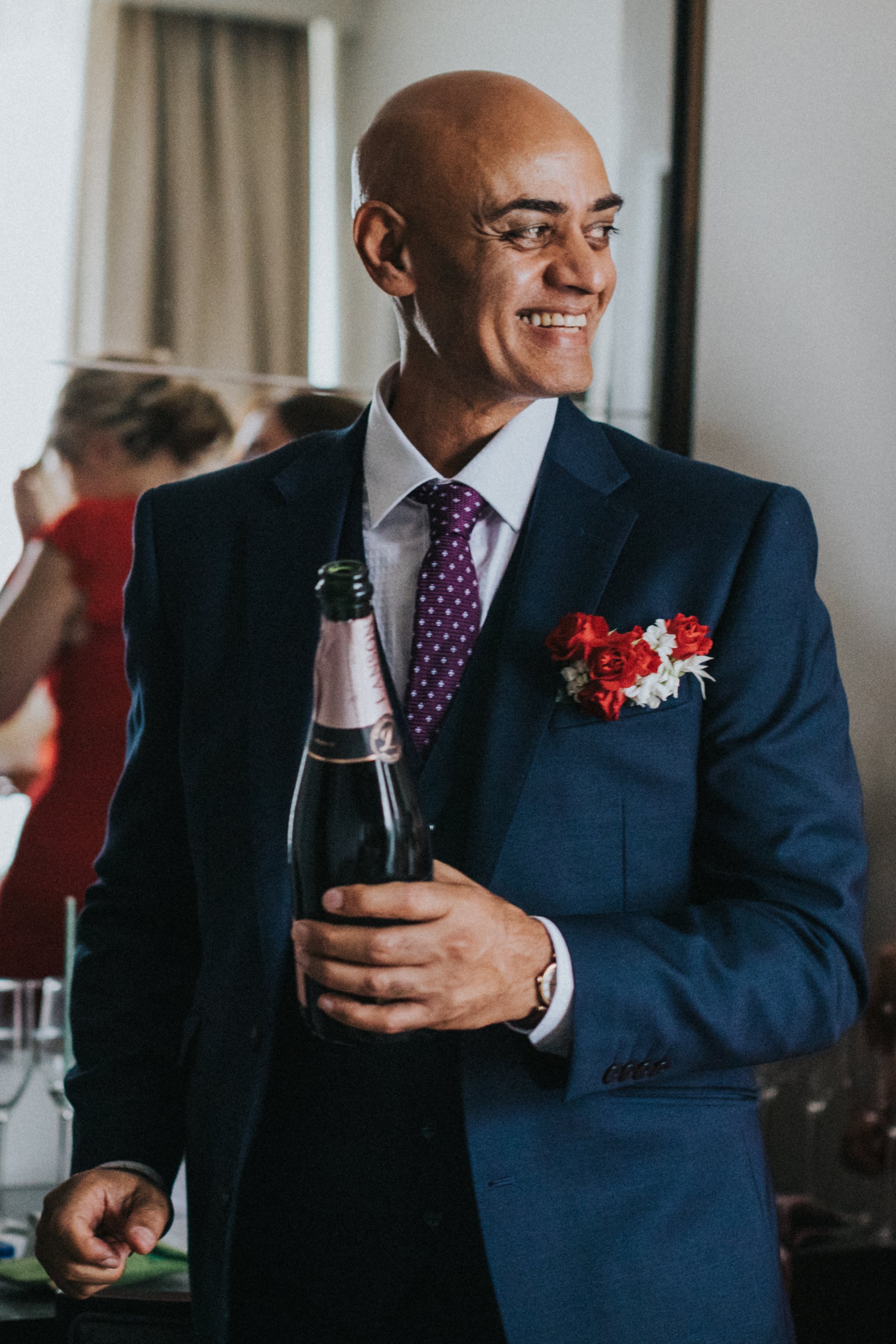 Father of the Bride cracks open some champagne. 
