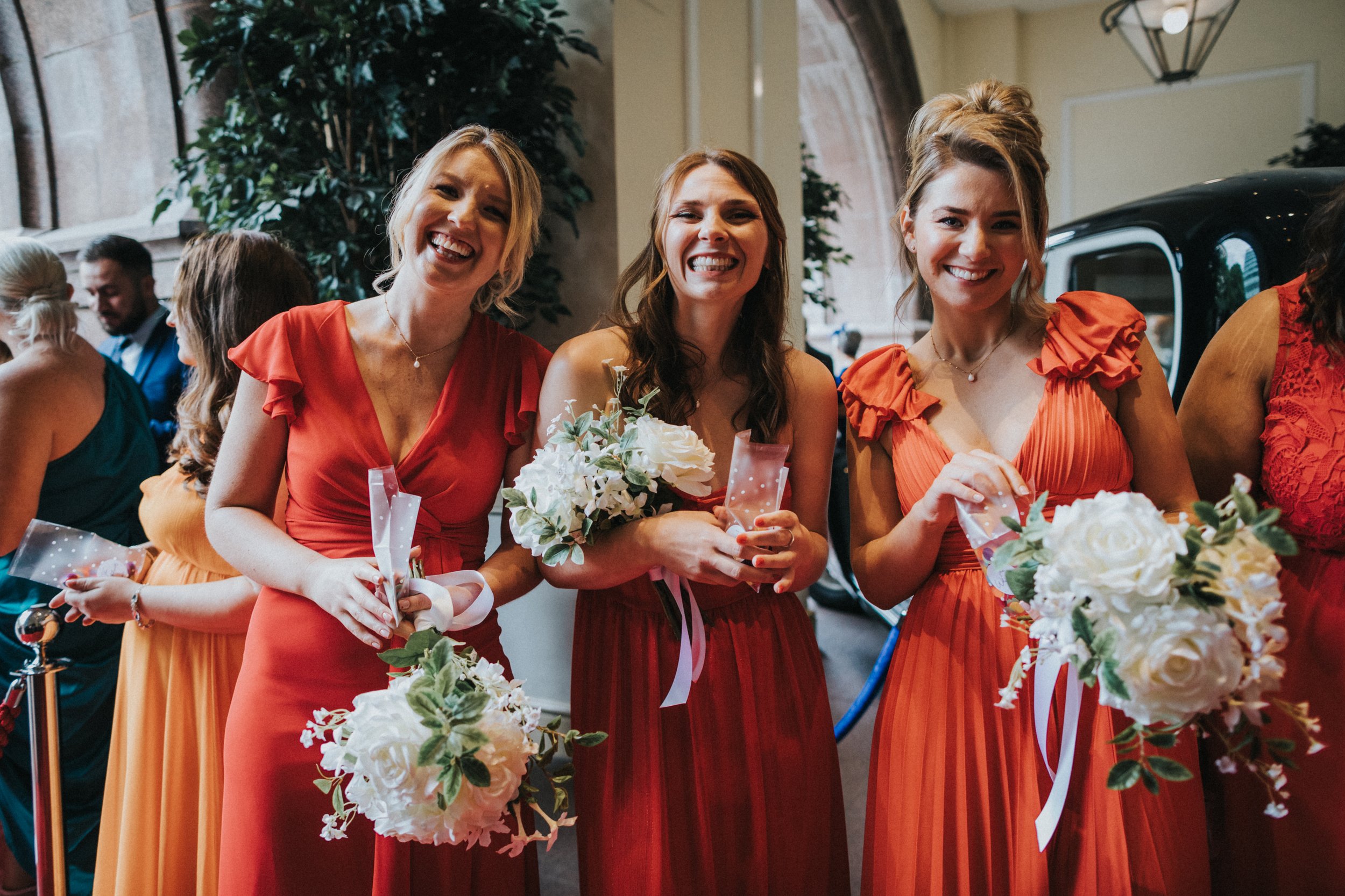 Bridesmaids line up with their confetti outside the Midland Hotel. 