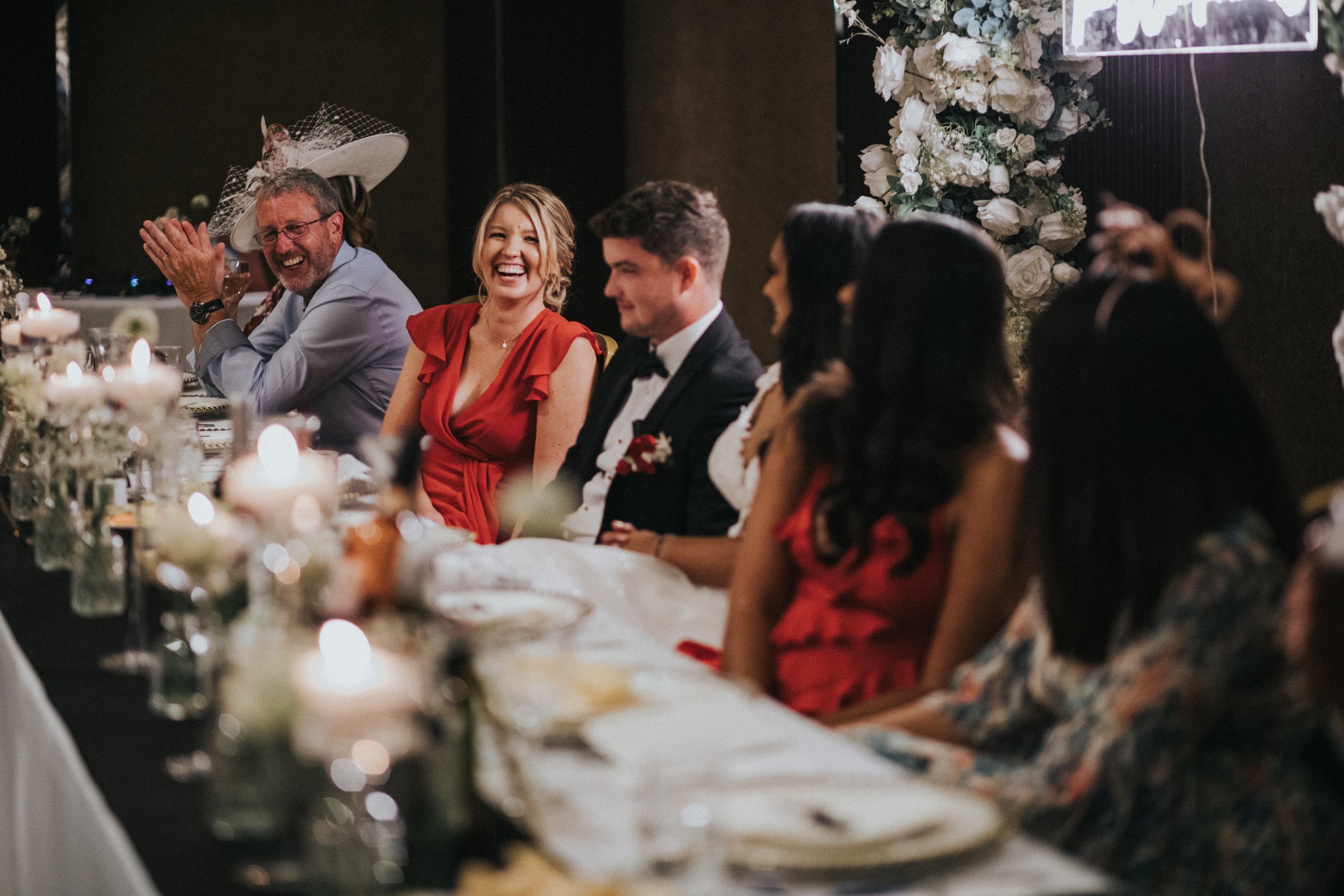 Sister of the Groom laughing at Best Mans speech. 