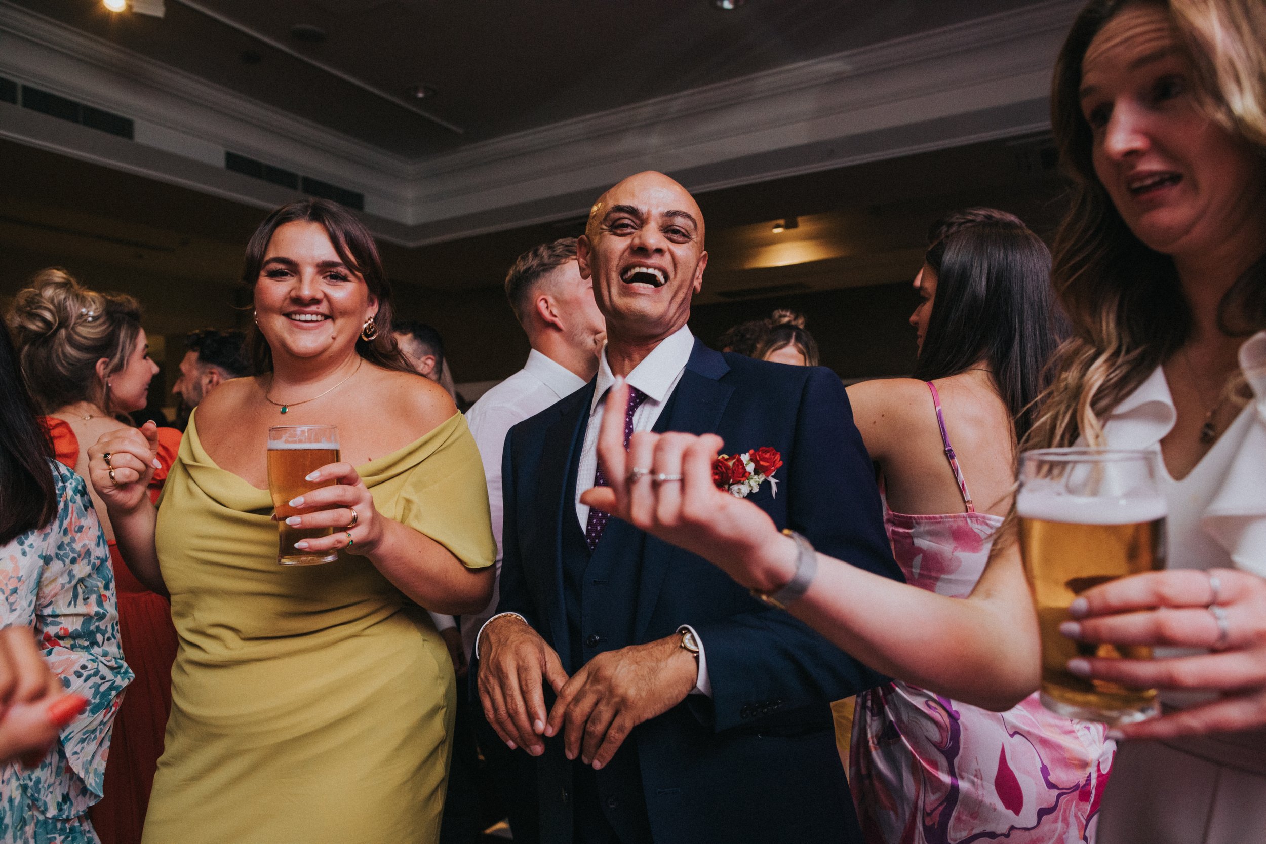 Father of the Bride laughing as he dances at his daughters wedding at The Midland Hotel.