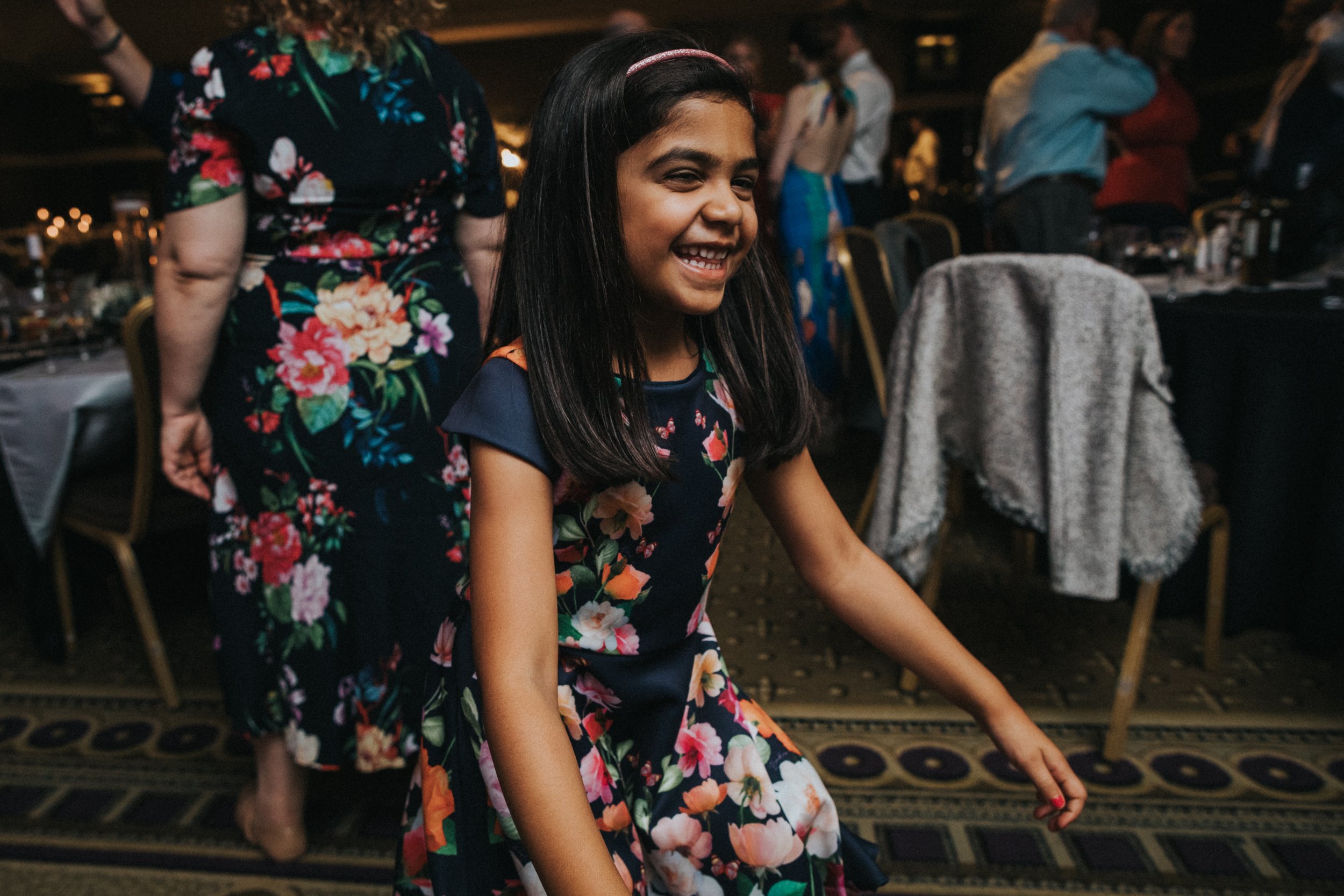 Little girl laughing and dancing. 