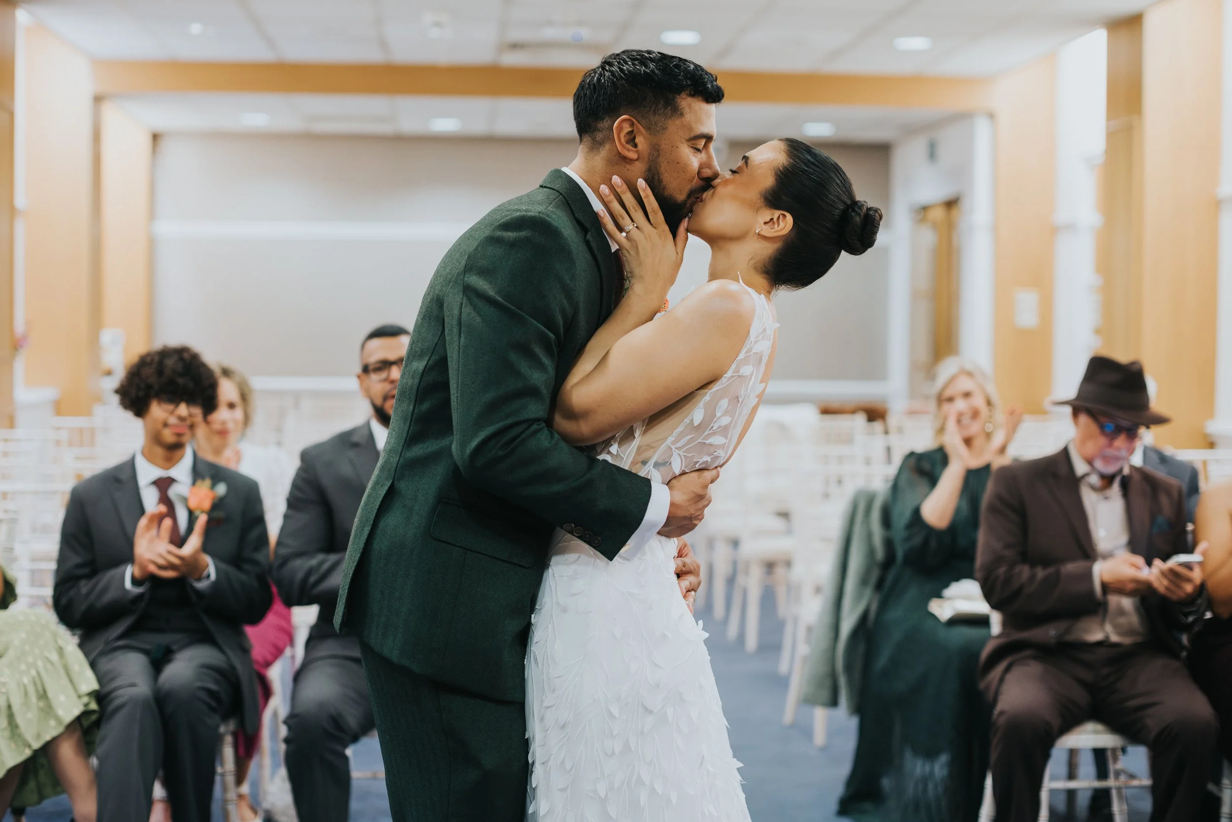 Bride and groom kiss in the Pankhurst suite manchester