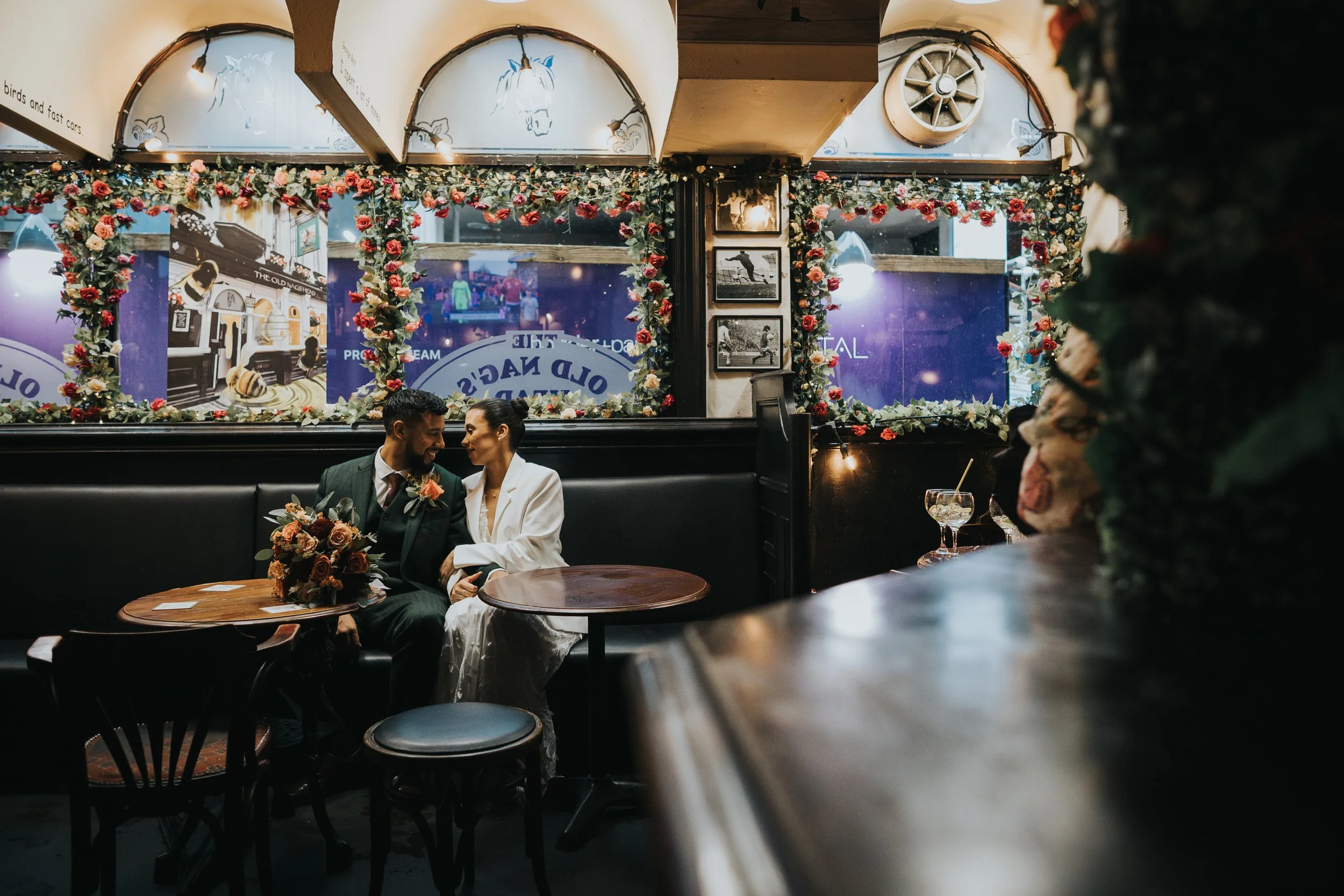 Bride and Groom kiss in the Nags Head pub, Manchester. 