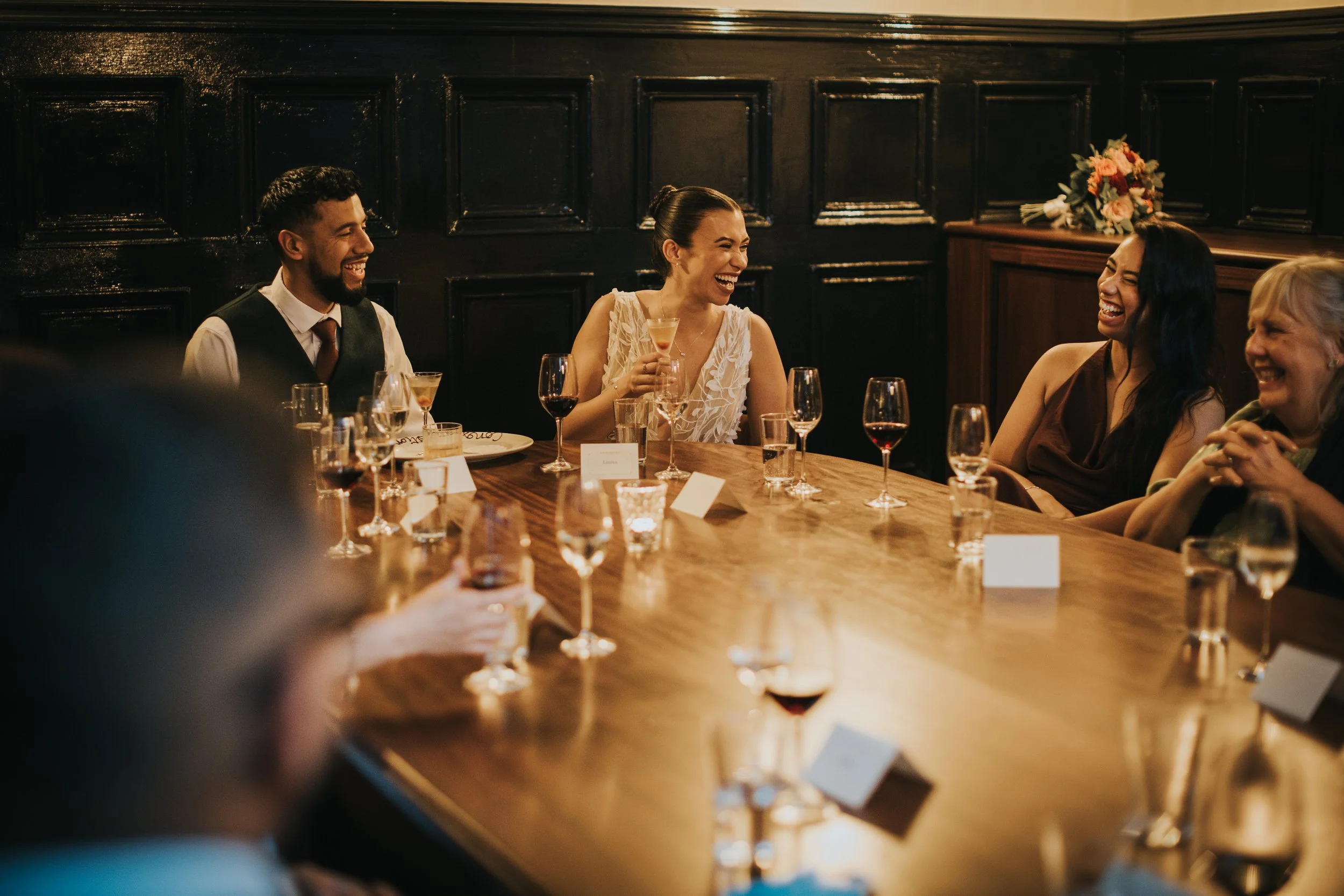 Bride and Groom laugh at speeches in The Hawksmoor Resturant, Manchester. 