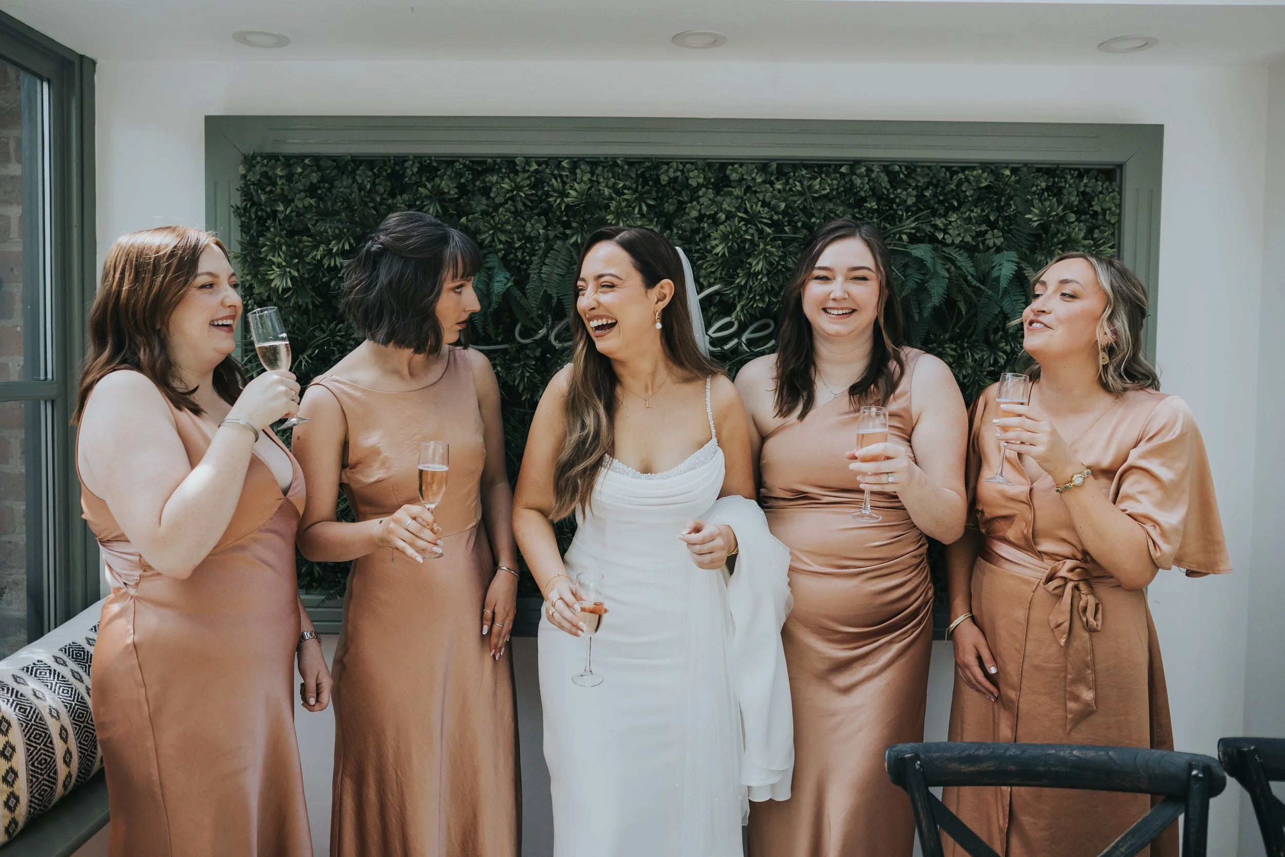 Bride and Bridesmaids laughing