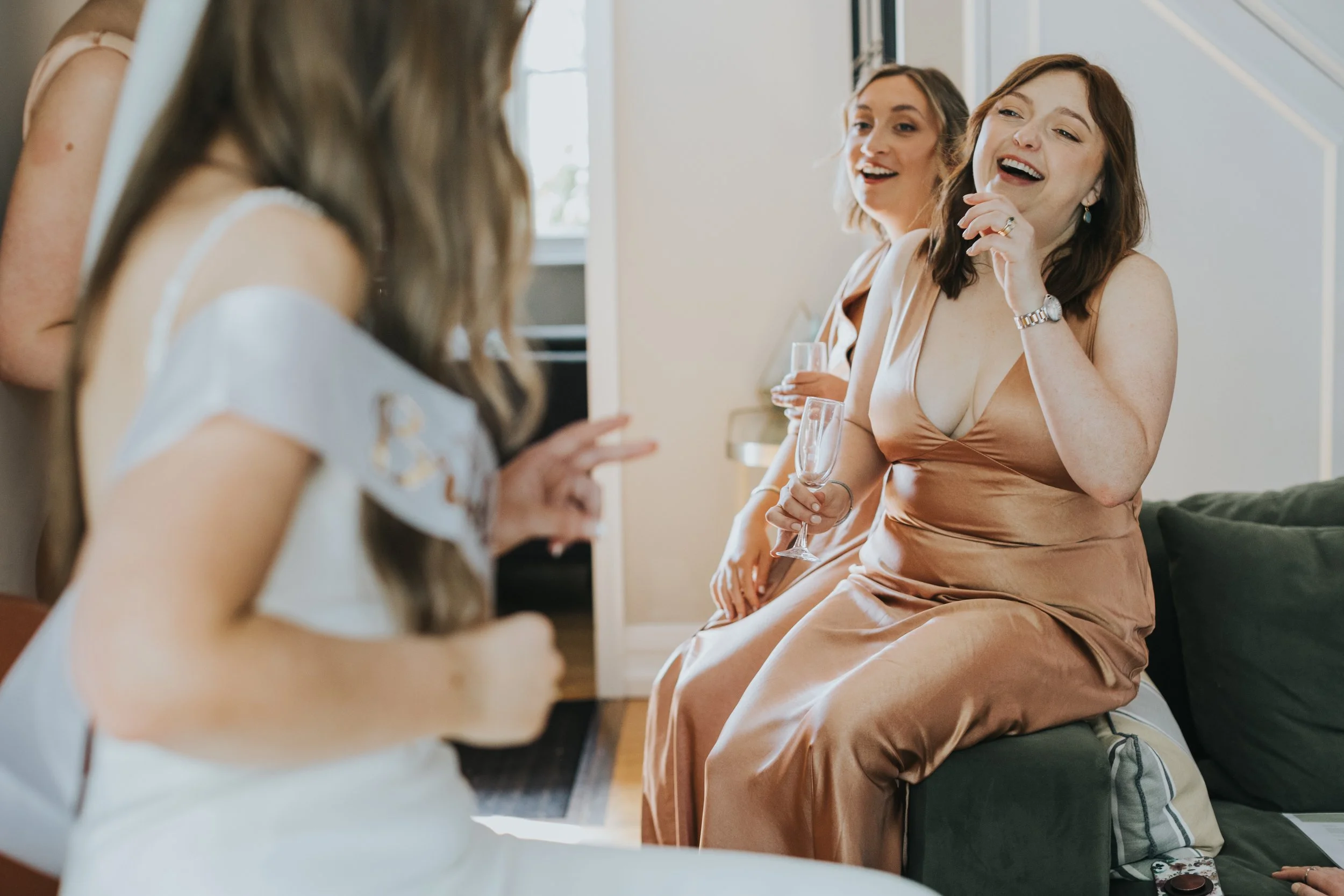 Bridesmaid laughing
