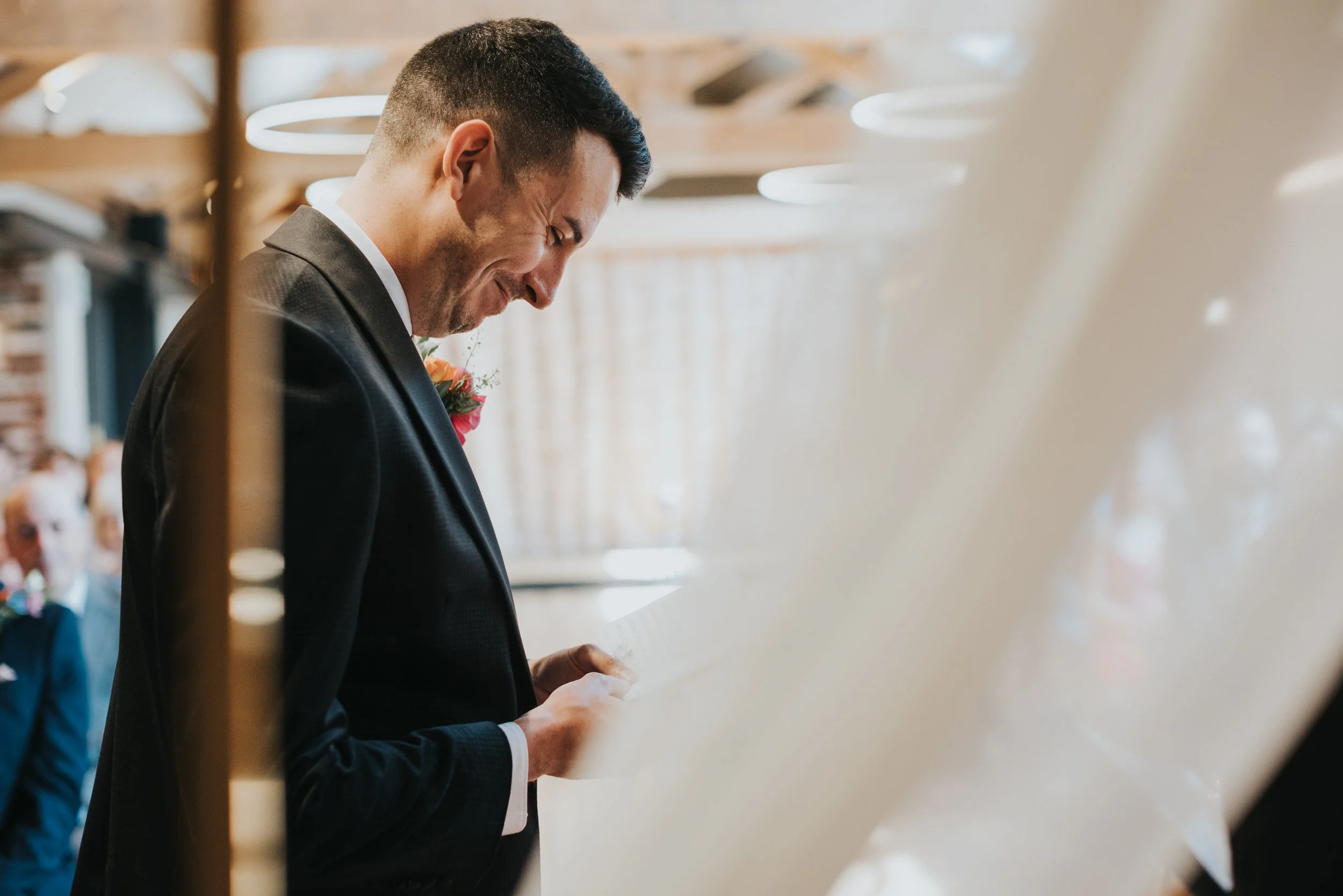 Groom reading his speech