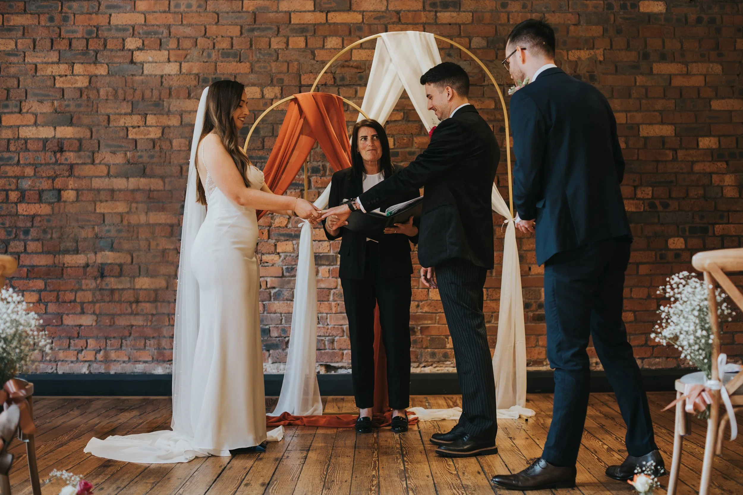 Bride and Groom exchange rings. 