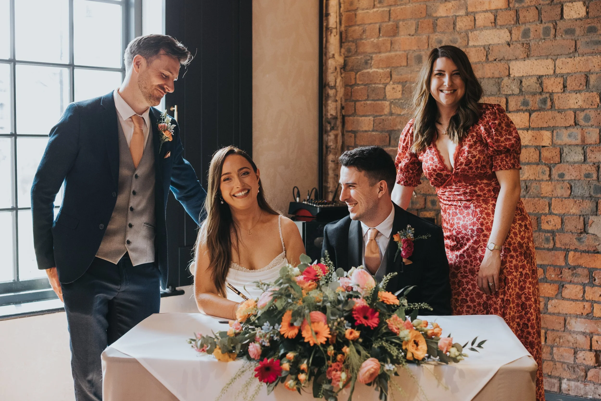 Bride and Groom have photo with witnesess. 