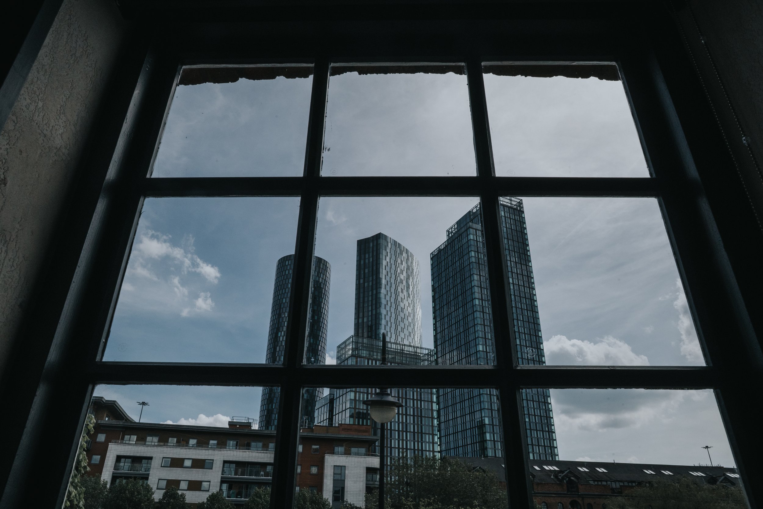 Manchester City Sky Scrapers framed by window. Jupiter. 