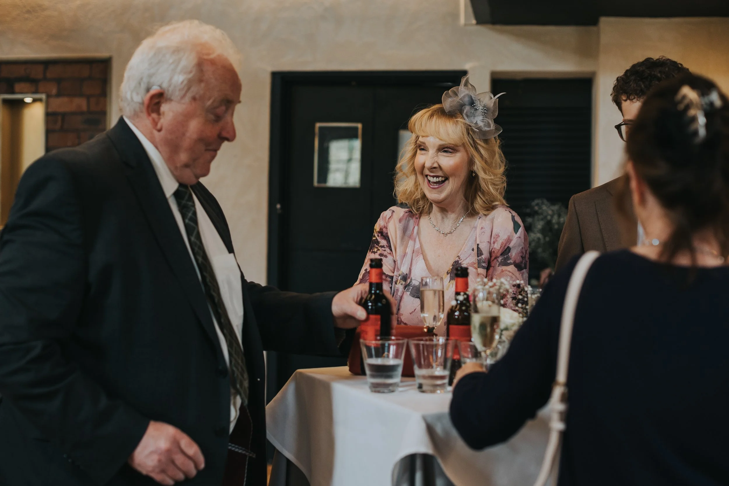Mother of the bride laughing. 