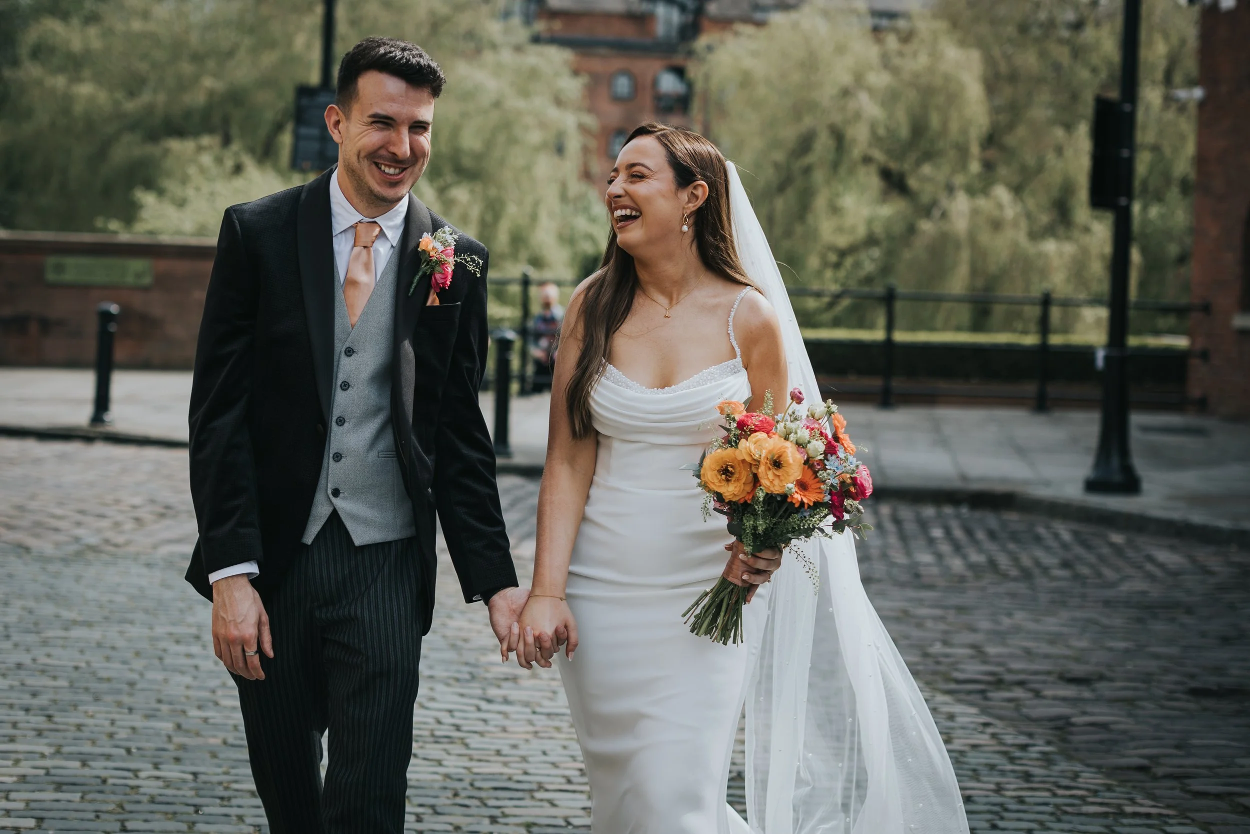 Bride and Groom laughing together. 