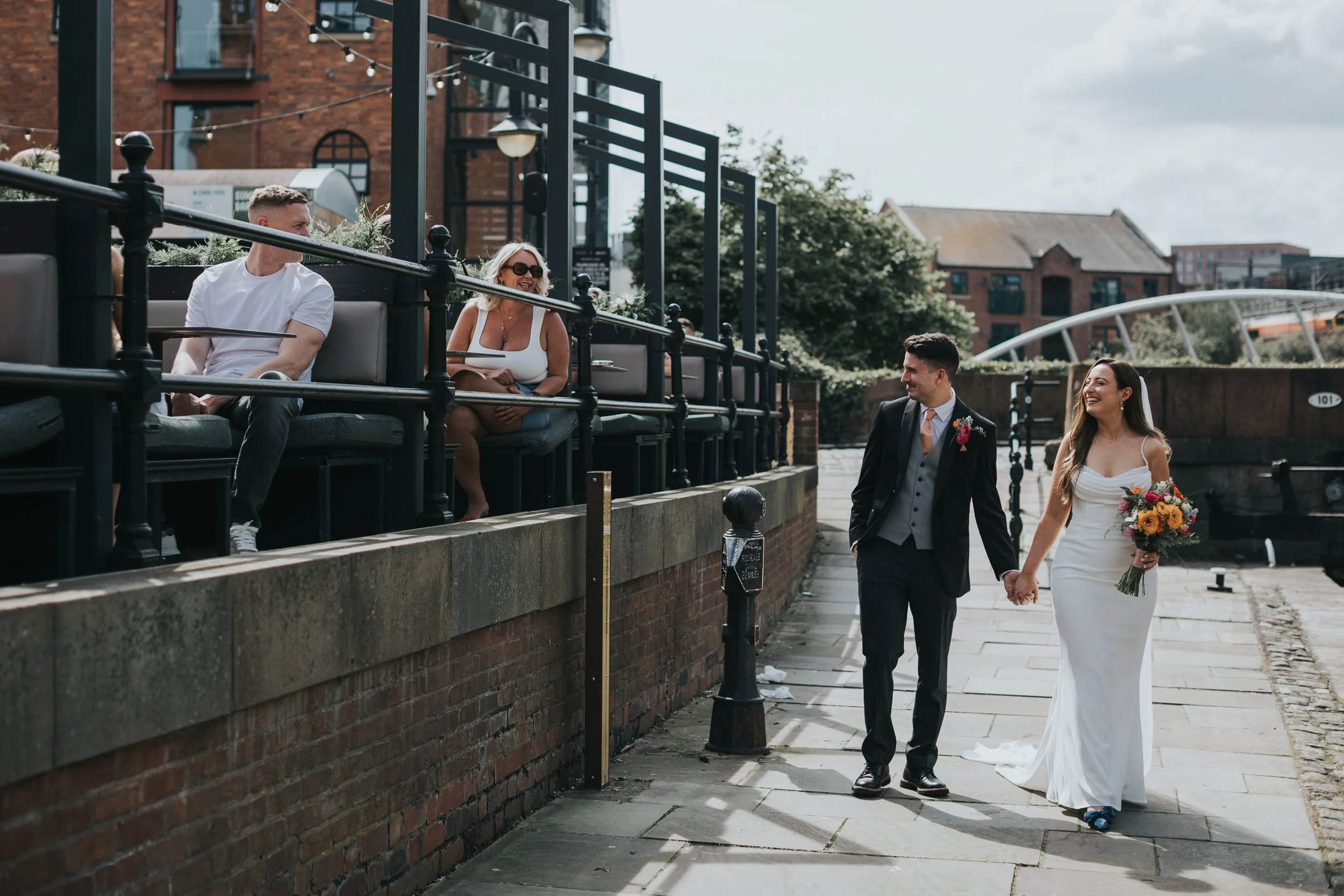 Members of the public congratulate the couple on their wedding day. 