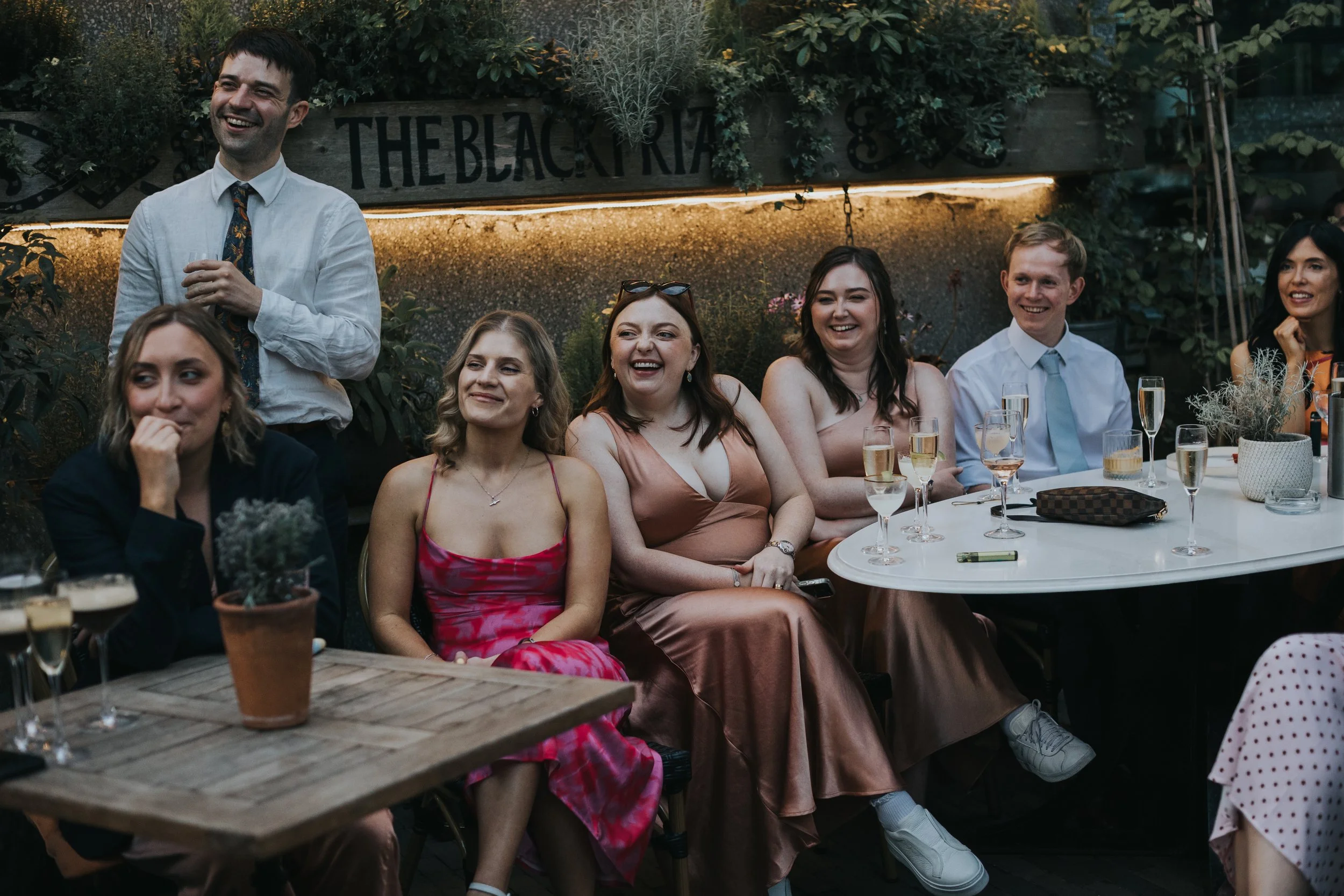 Bridesmaids laughing. 