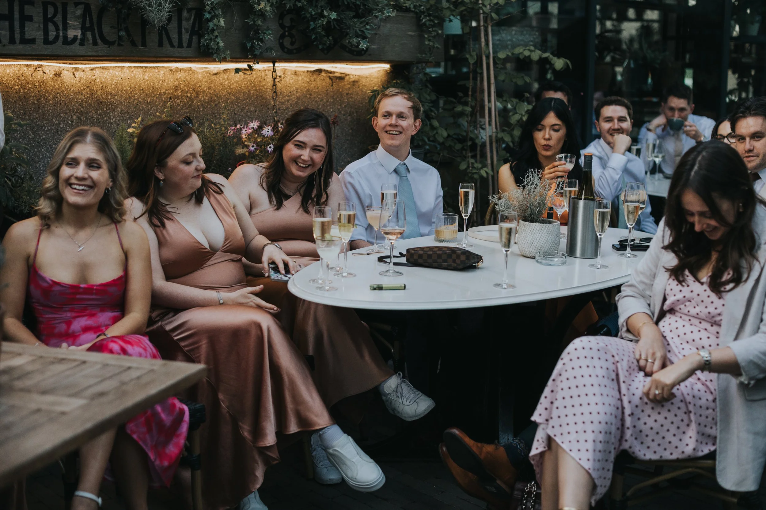 Guests laughing. 