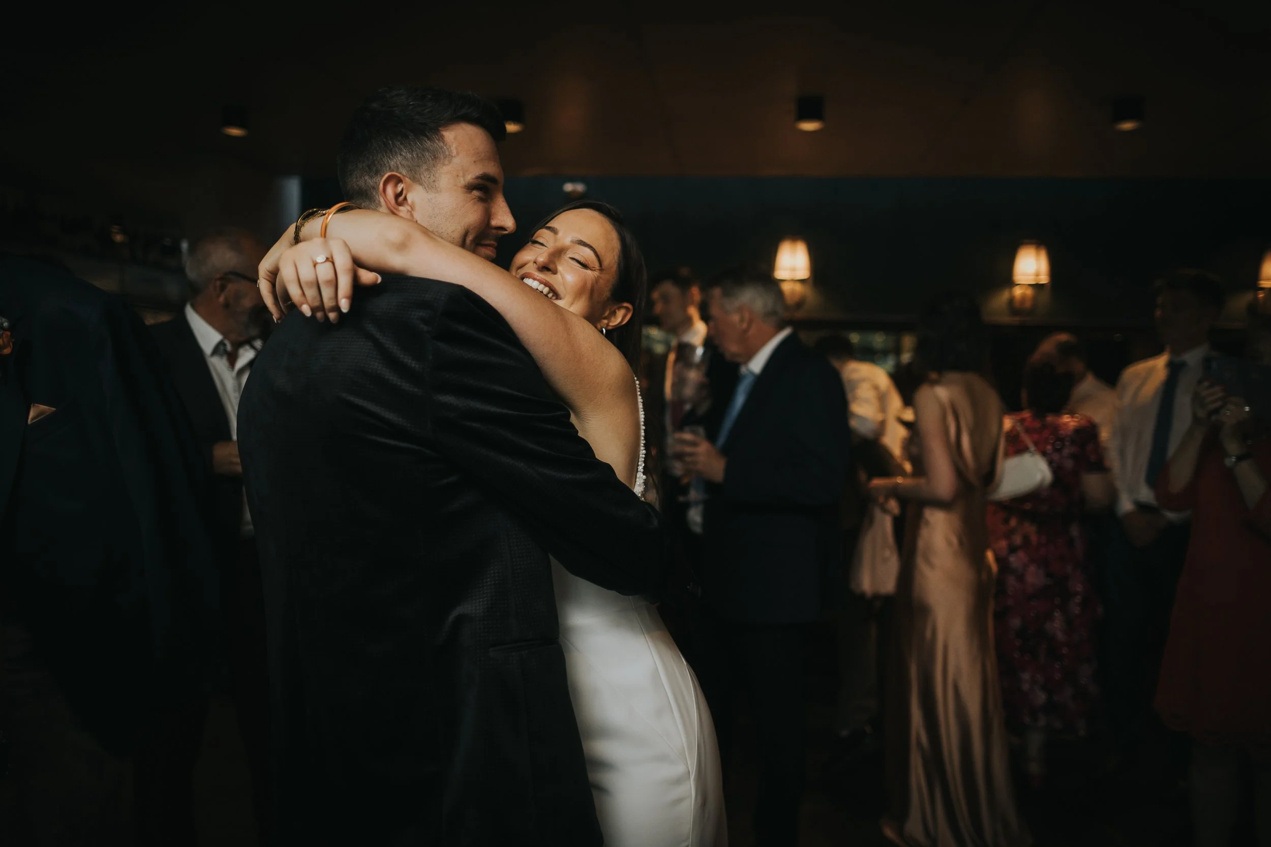 Bride and Groom have a moment on the dance floor and Black Friars Pub. 