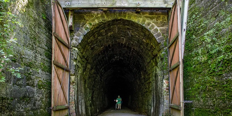 One of three large tunnels that the Sparta-Elroy trail passes through. Photo by TravelWisconsin.com