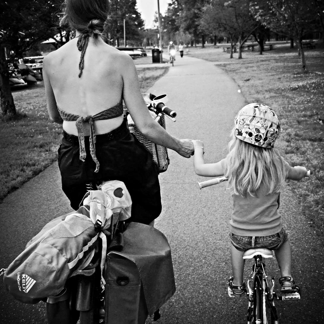 Bikabout-Megan-Ramey-holding-hands-with-daughter-biking.jpg