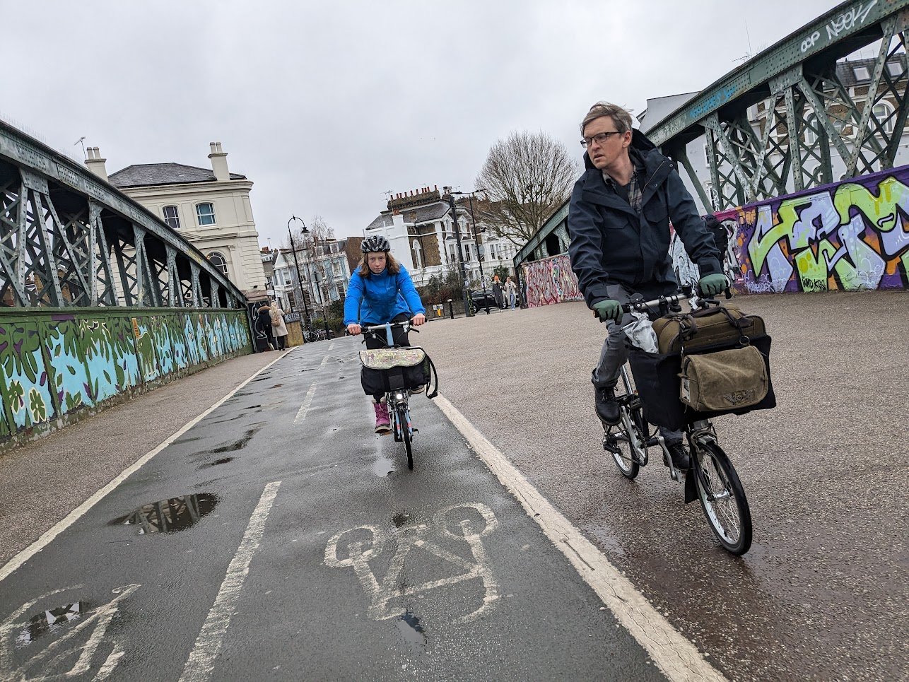 Dad and daughter ride the Regent’s Park Road bike and footbridge in Camden town.