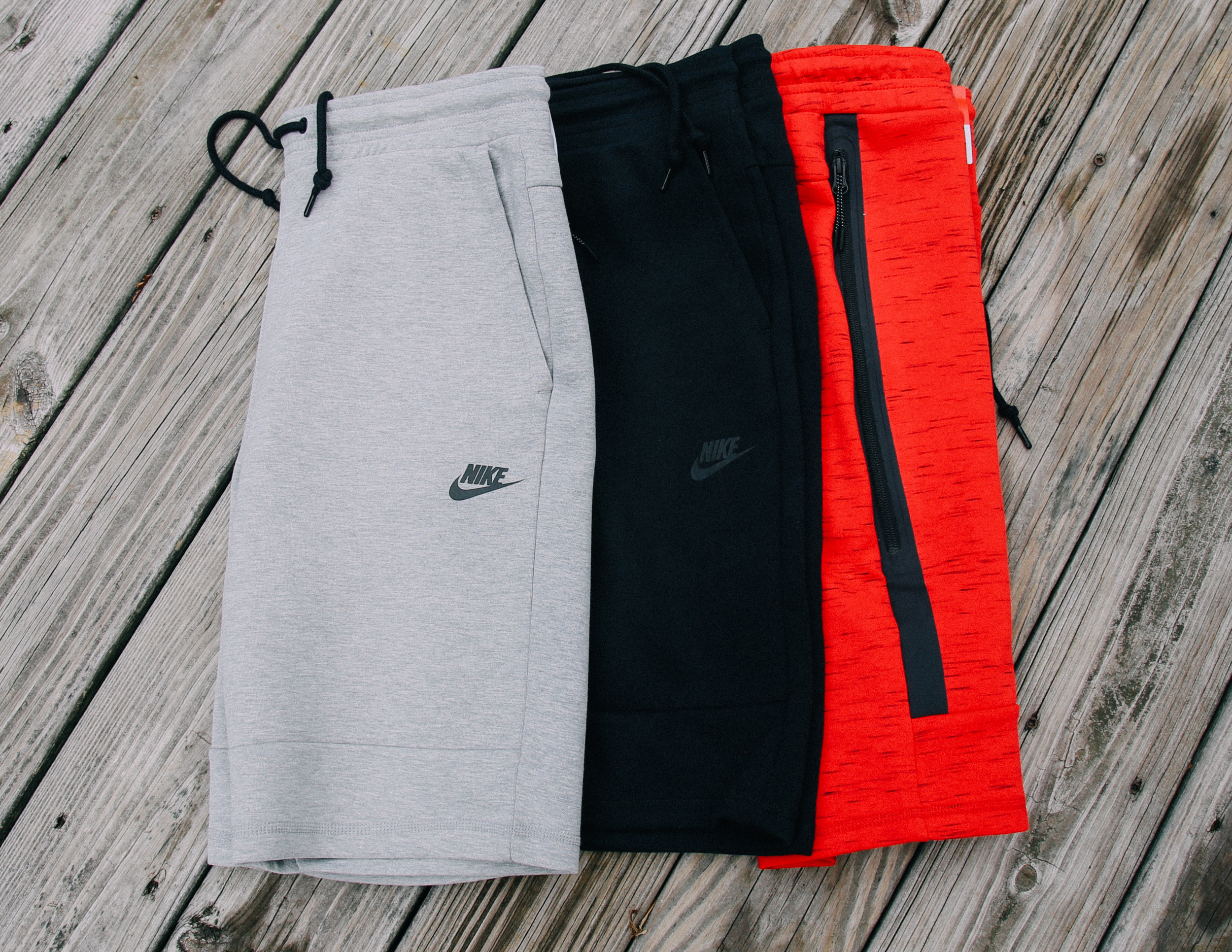 red nike tech shorts