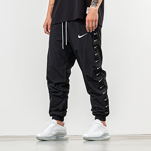 nike swoosh taped pants