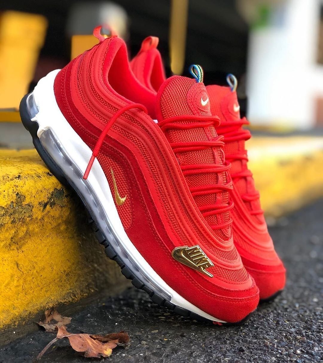 gold and red air max 97