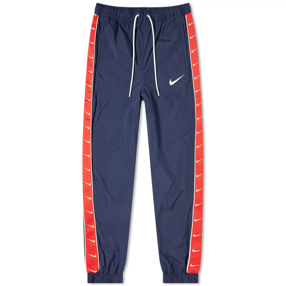 25-06-2019_nike_tapedswooshwovenpant_obsidianuniversityred_cd0421-451_th_1_1.png