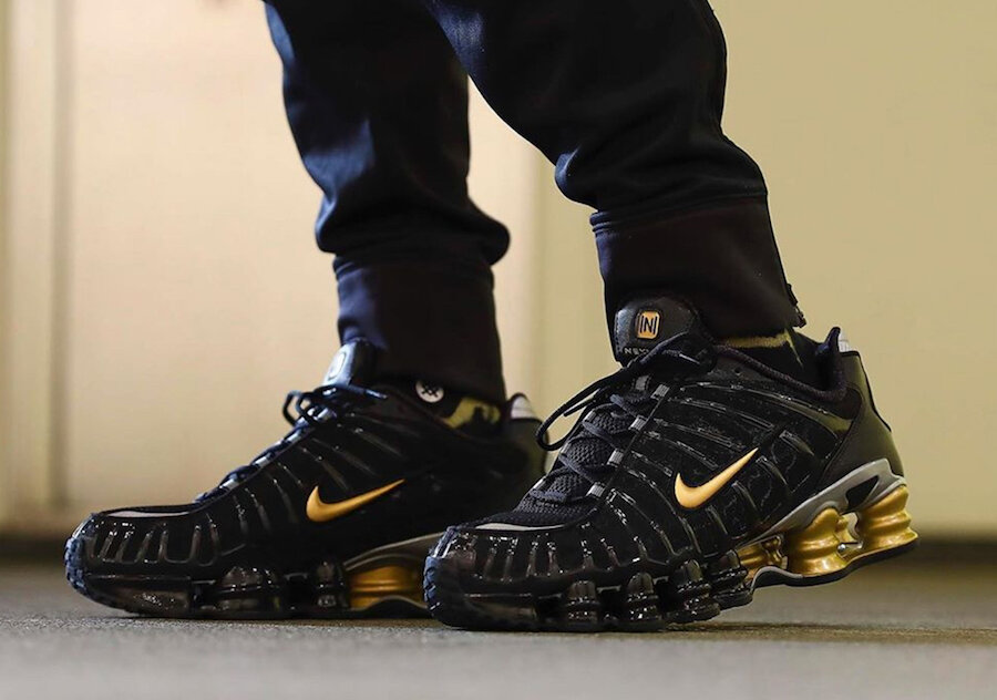 nike gold and black sneakers